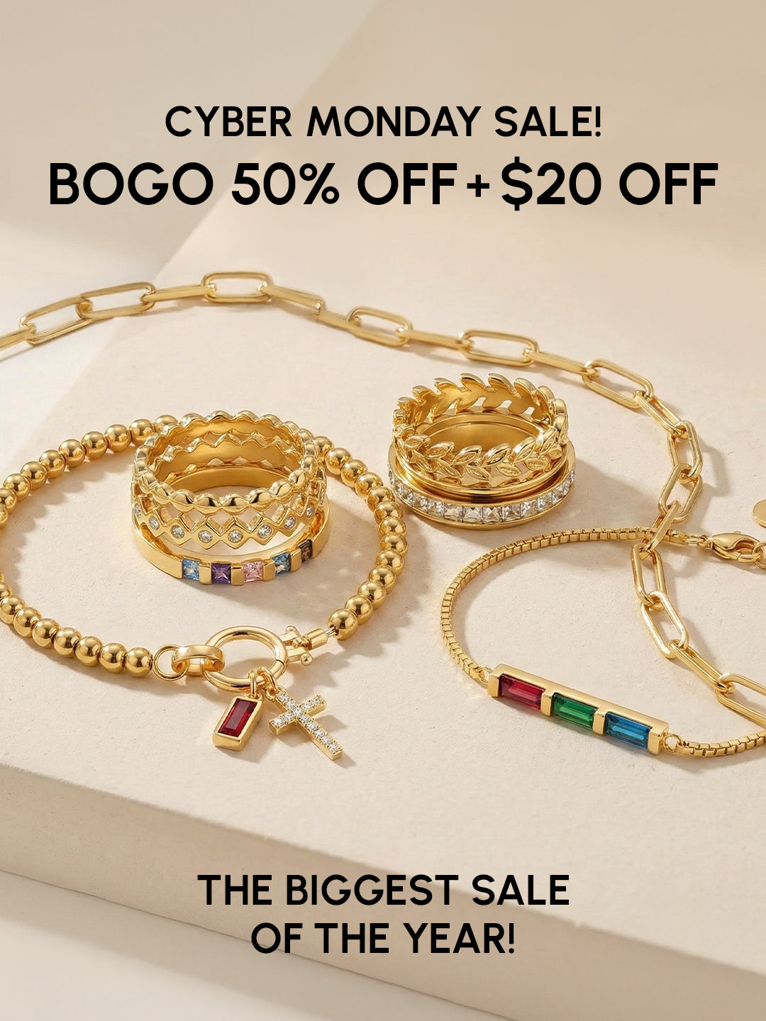 Gold jewelry set with 'Cyber Monday Sale' text on a beige background