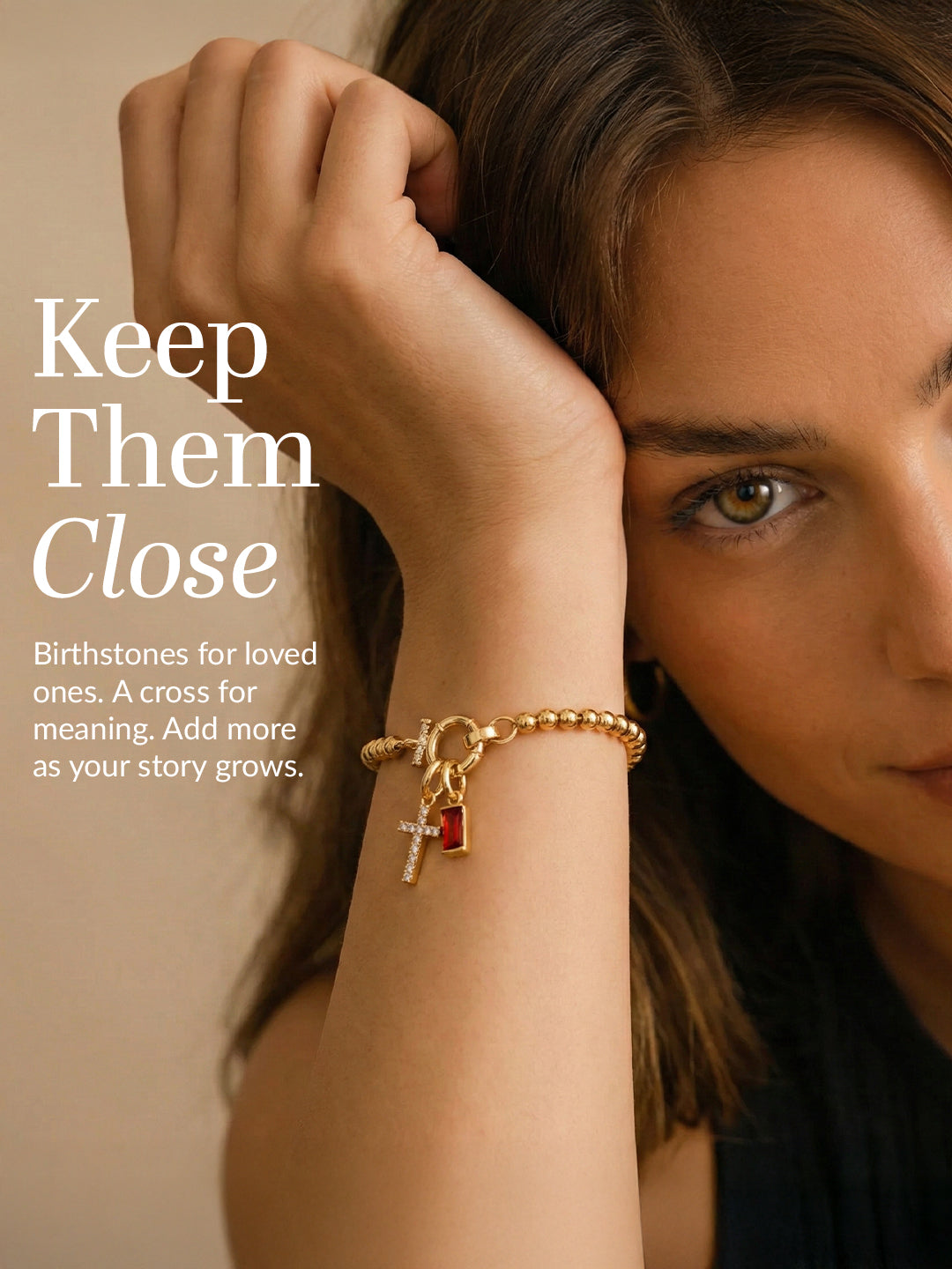 Woman wearing a gold bracelet with a cross charm, text 'Keep Them Close' on a beige background.