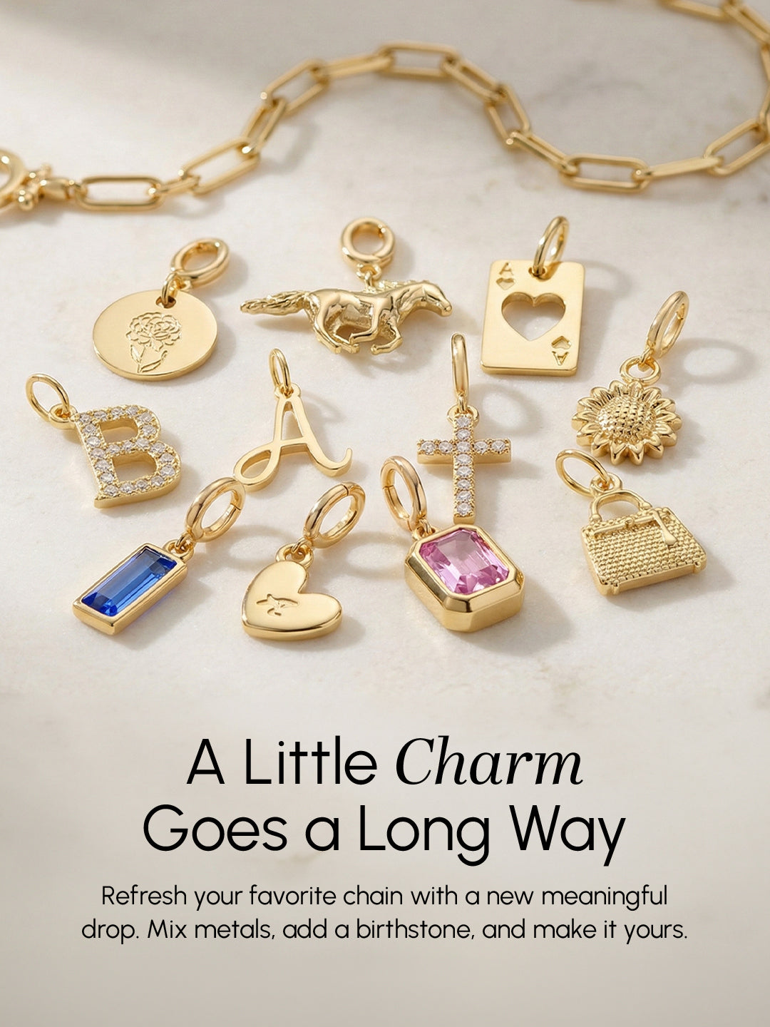 Gold charms and a chain on a light background with text about customizable jewelry.
