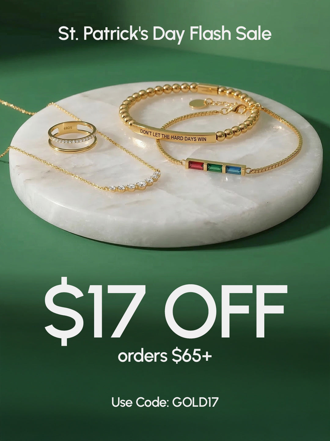 Jewelry set on a marble tray with St. Patrick's Day flash sale text on a green background