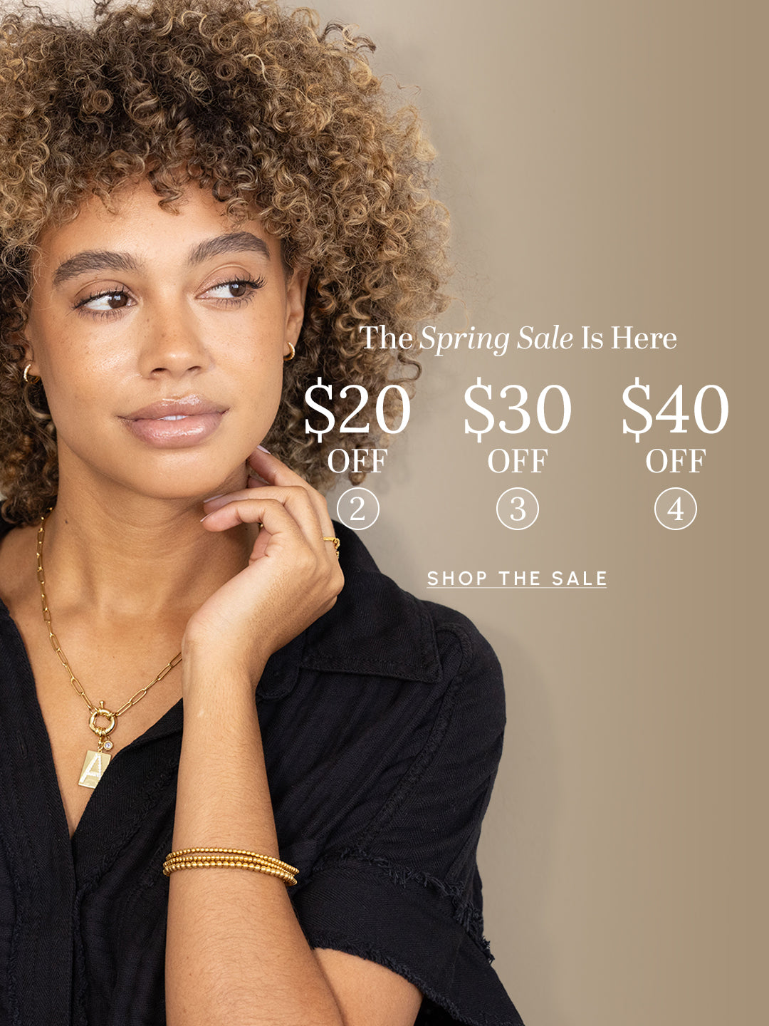 Woman wearing jewelry with text overlay for a spring sale promotion.