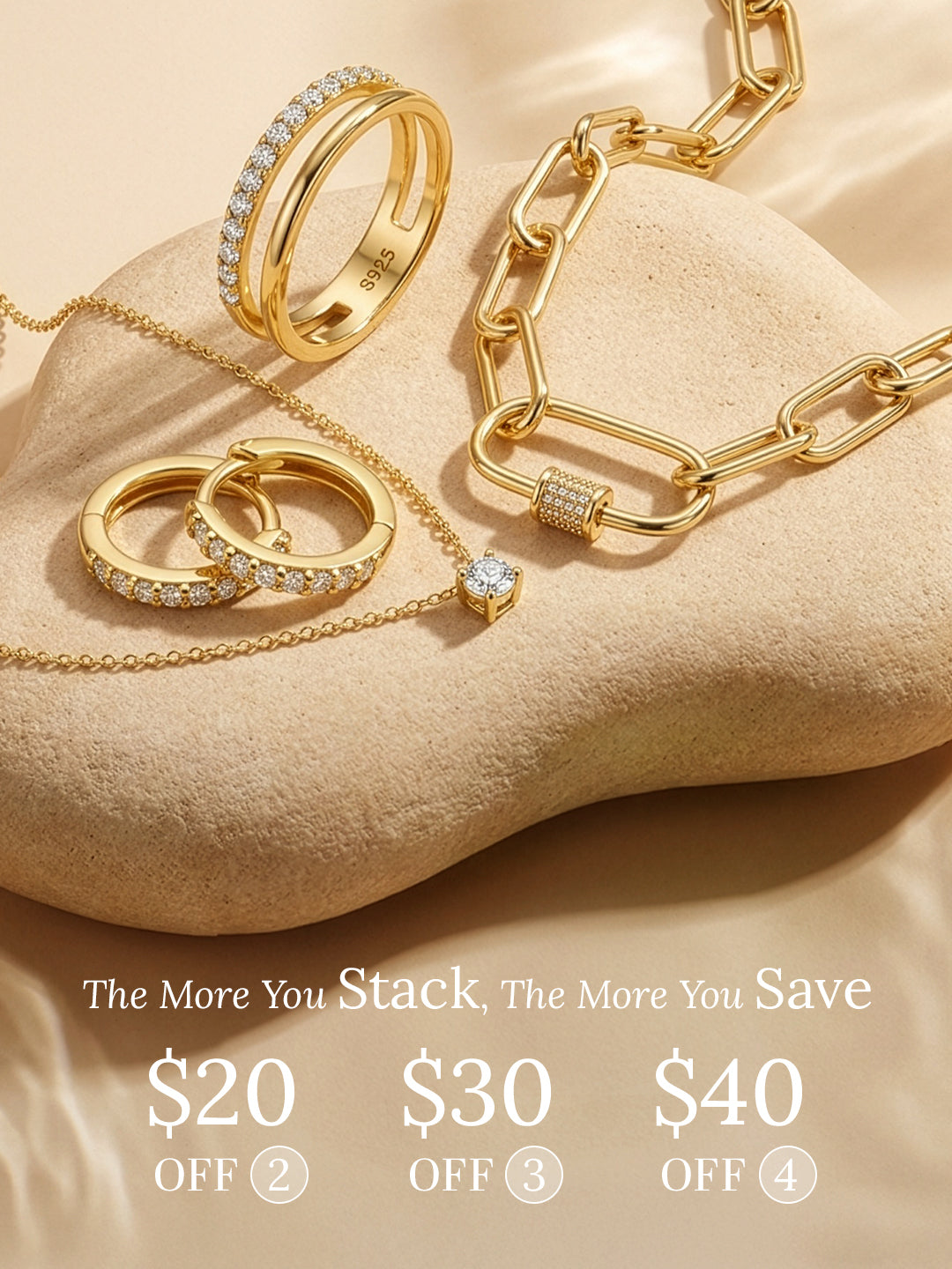 Gold jewelry set including rings and a necklace on a beige surface with promotional text.