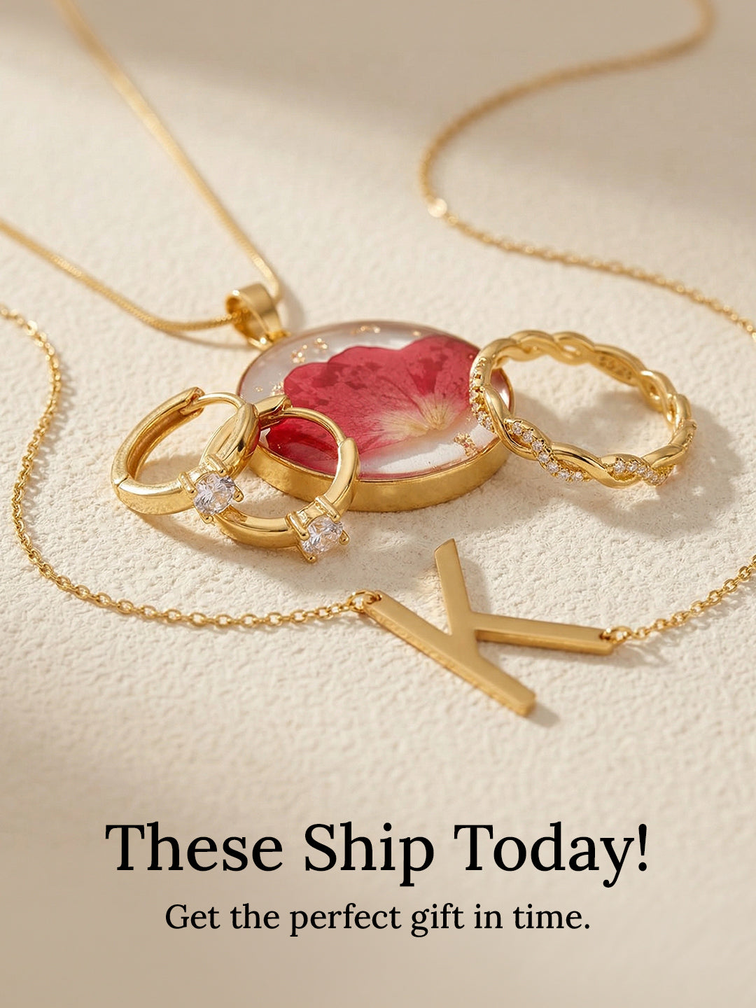 Gold necklace with a red rose pendant on a beige background
