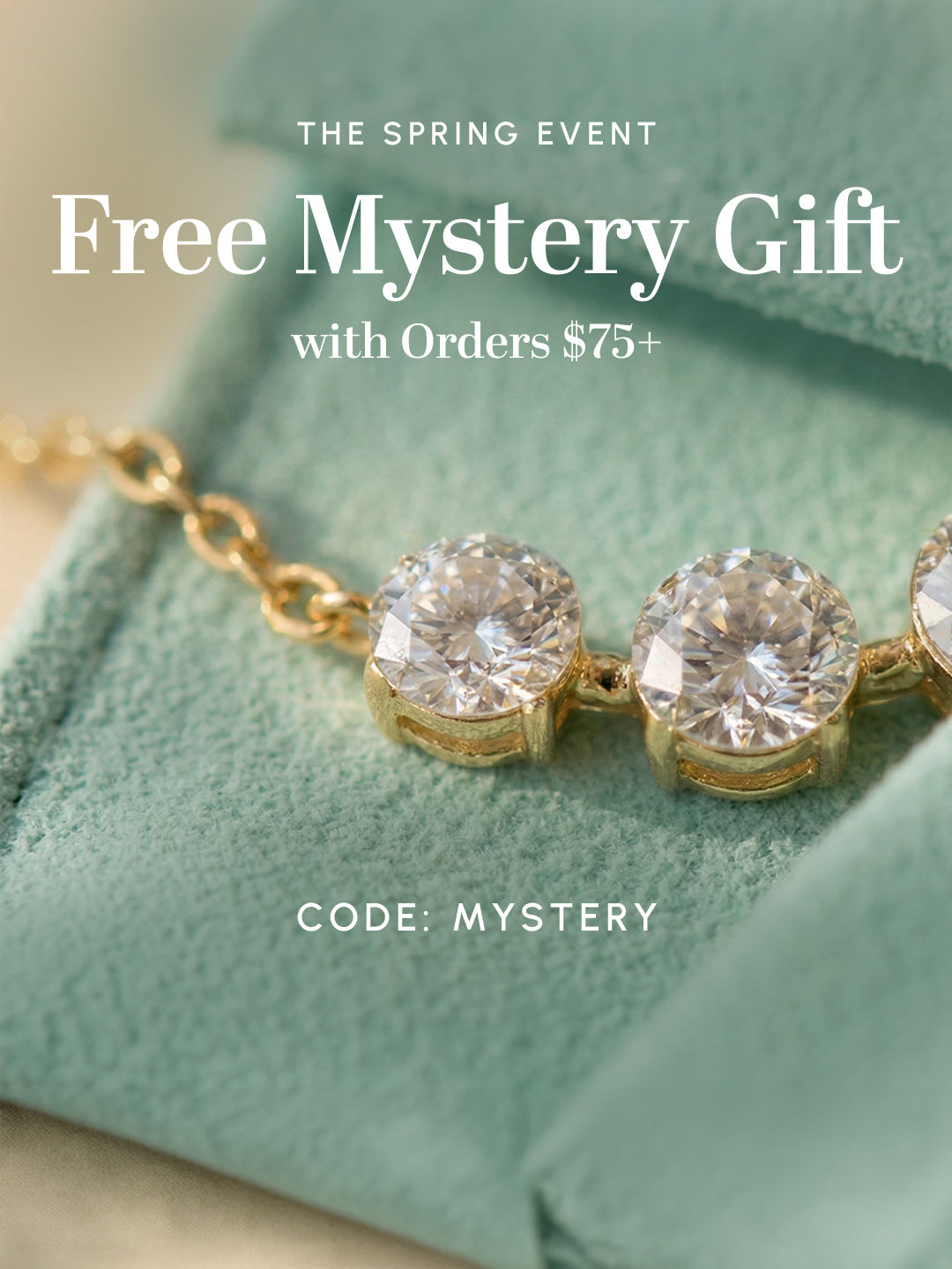 Close-up of gold gemstone necklace with ‘Free Mystery Gift with orders $75+’ promotion and code MYSTERY.