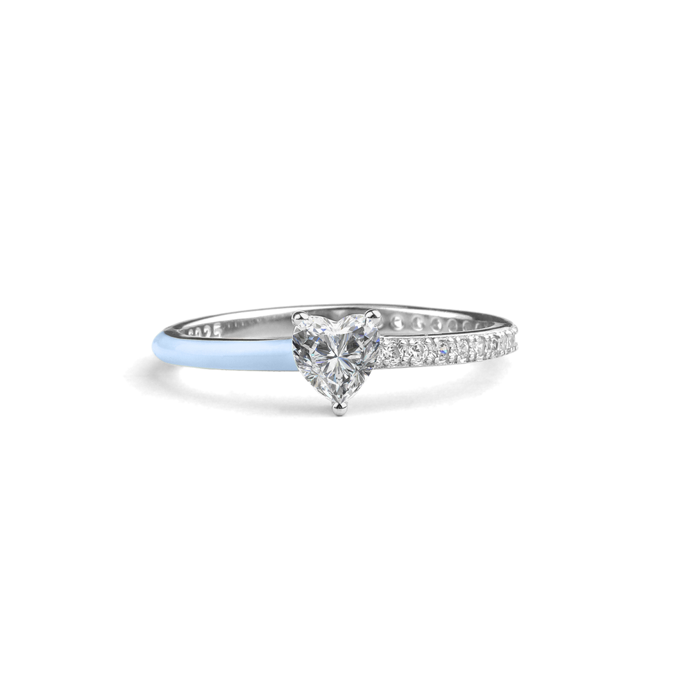 A heart-cut half enamel ring with a message card that includes the text 'No One Is You And That Is Your Power'.