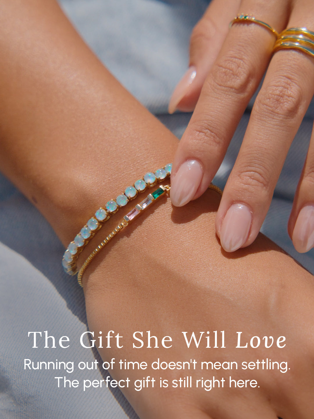 Close-up of a hand wearing a bracelet with a message about finding the perfect gift.