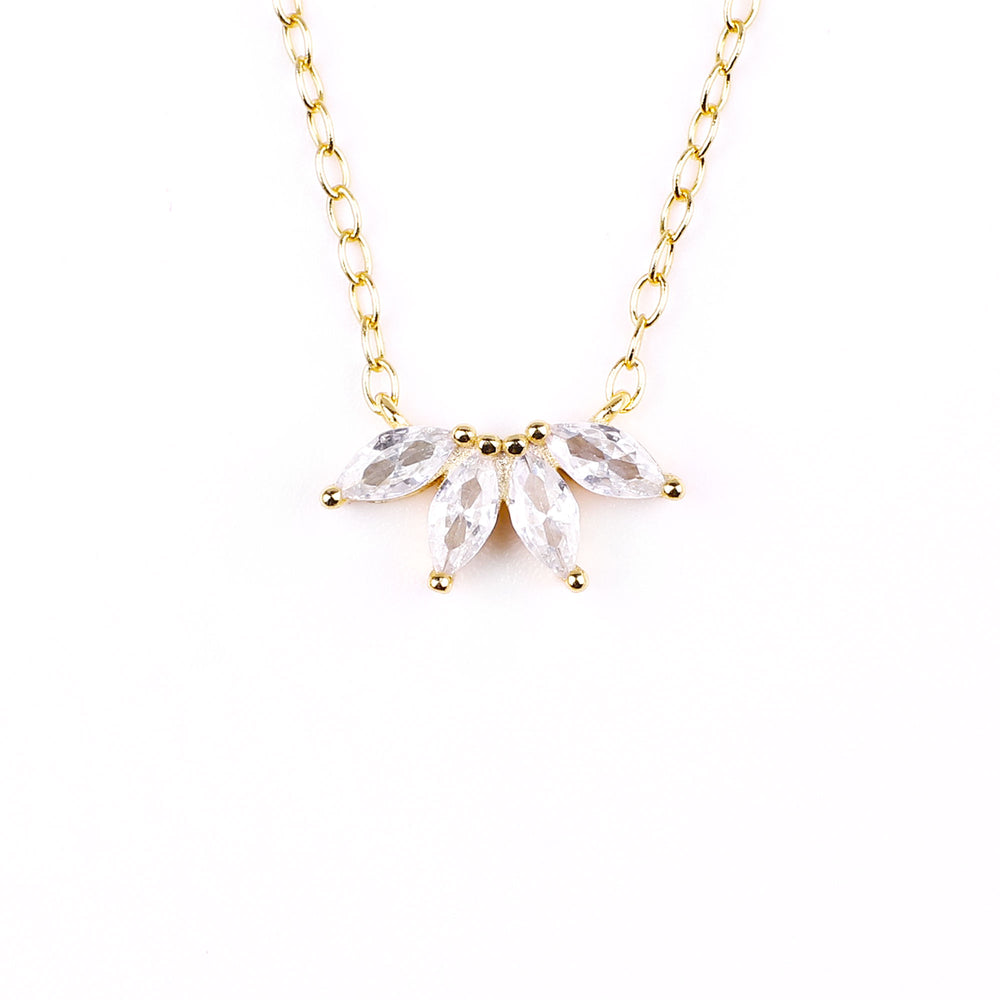 A gold-colored necklace featuring a pair of marquise-cut zircon stones pendant from a chain of round beads.