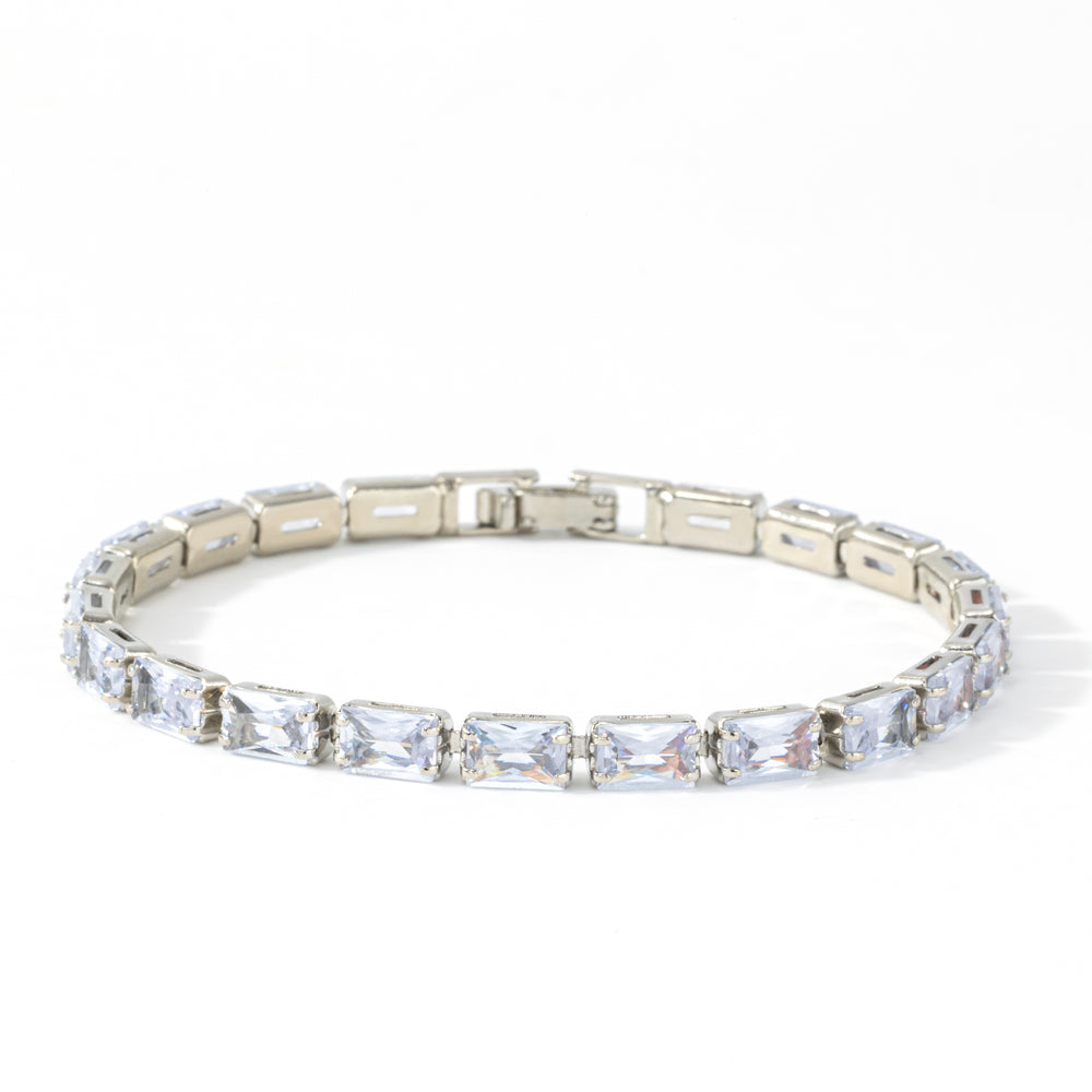 Silver baguette tennis bracelet with cubic zirconia stones on a white background