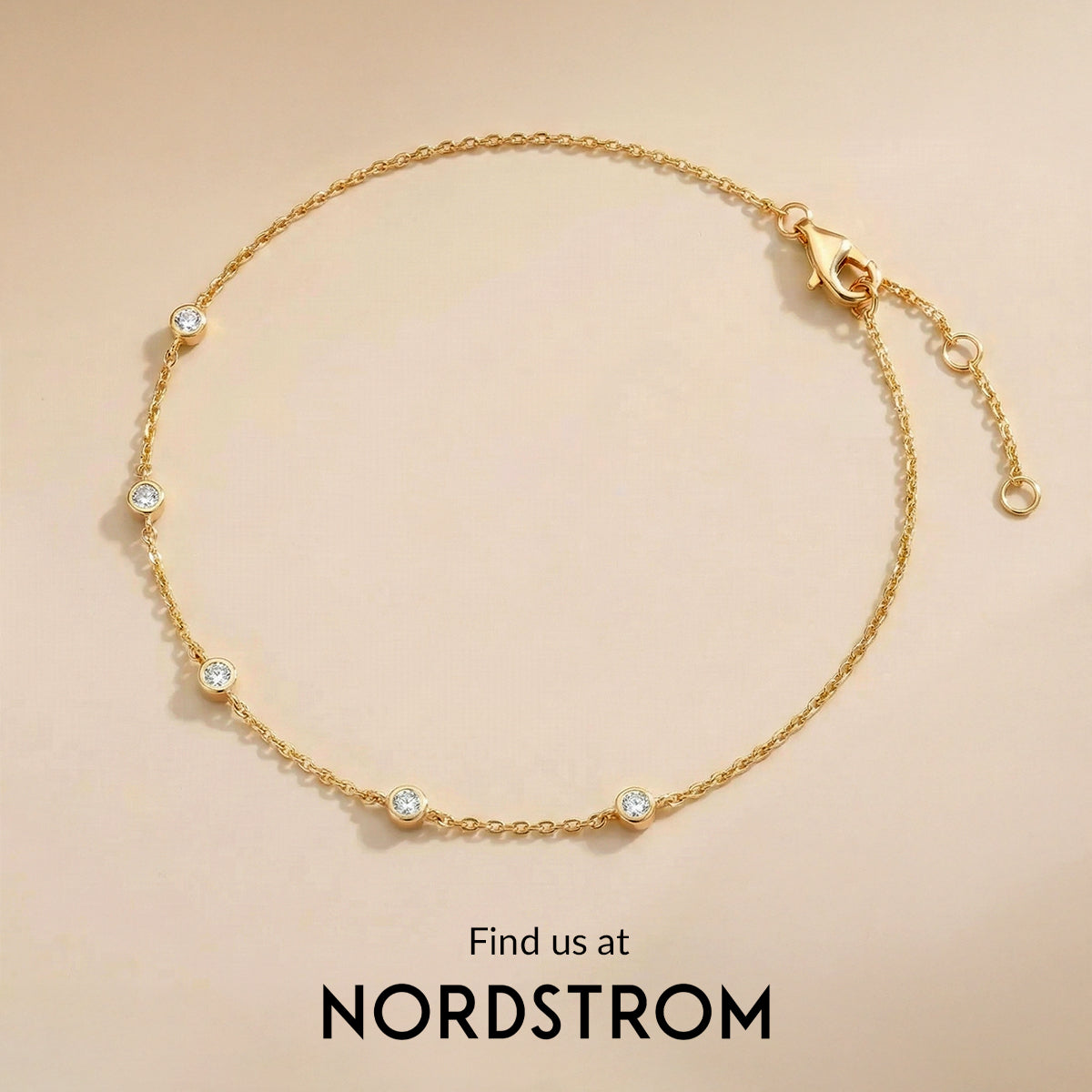 Gold bracelet with small crystals on a beige background, Nordstrom branding visible.