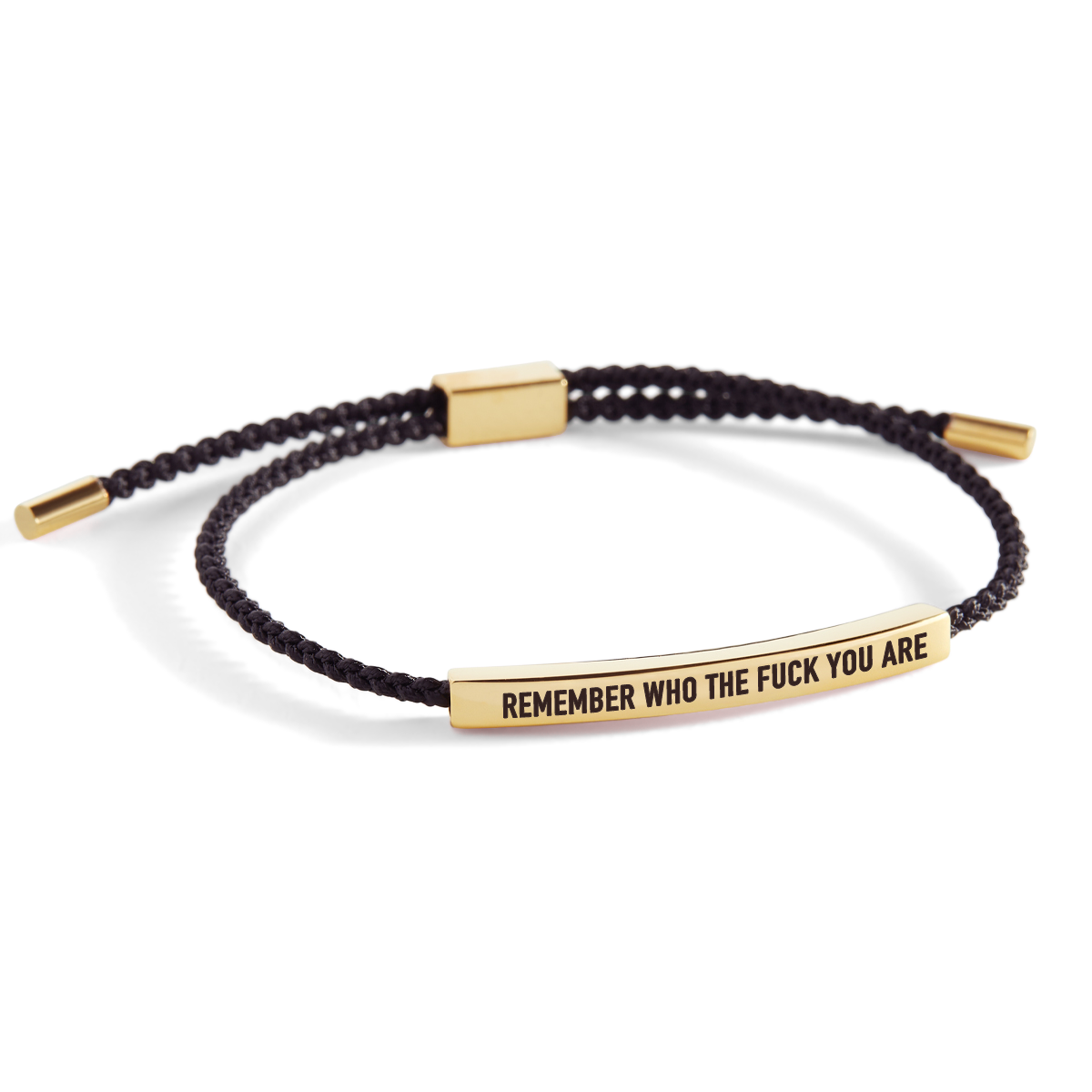 A braided bracelet with a gold-plated bar that reads 'remember who the f*** you are', displayed against a white background with the text 'remember who the f*** you are' overlaid on top.