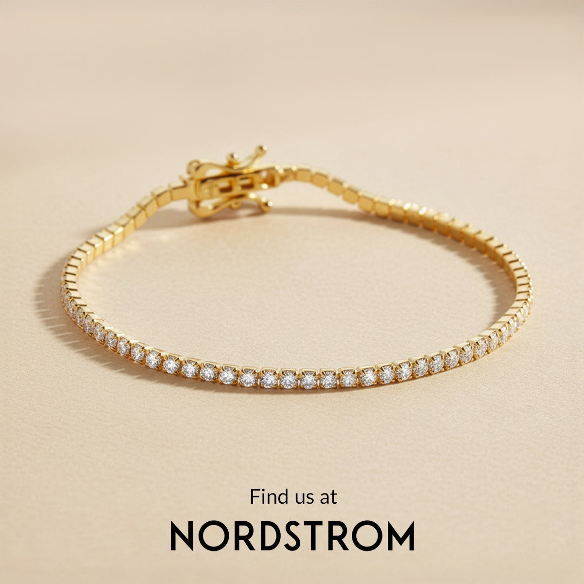Gold bracelet with diamonds on a beige background, Nordstrom branding visible.