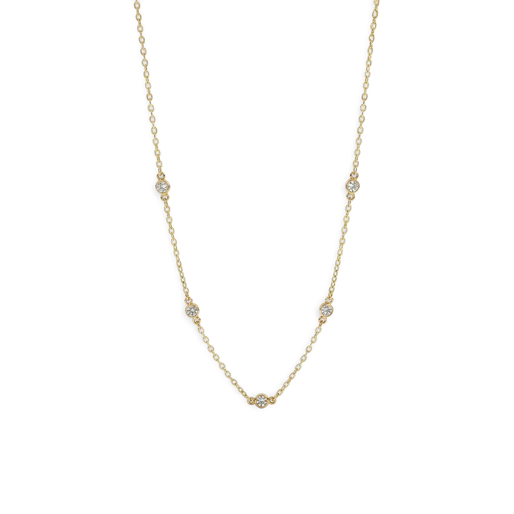 Gold necklace with small diamonds on a white background