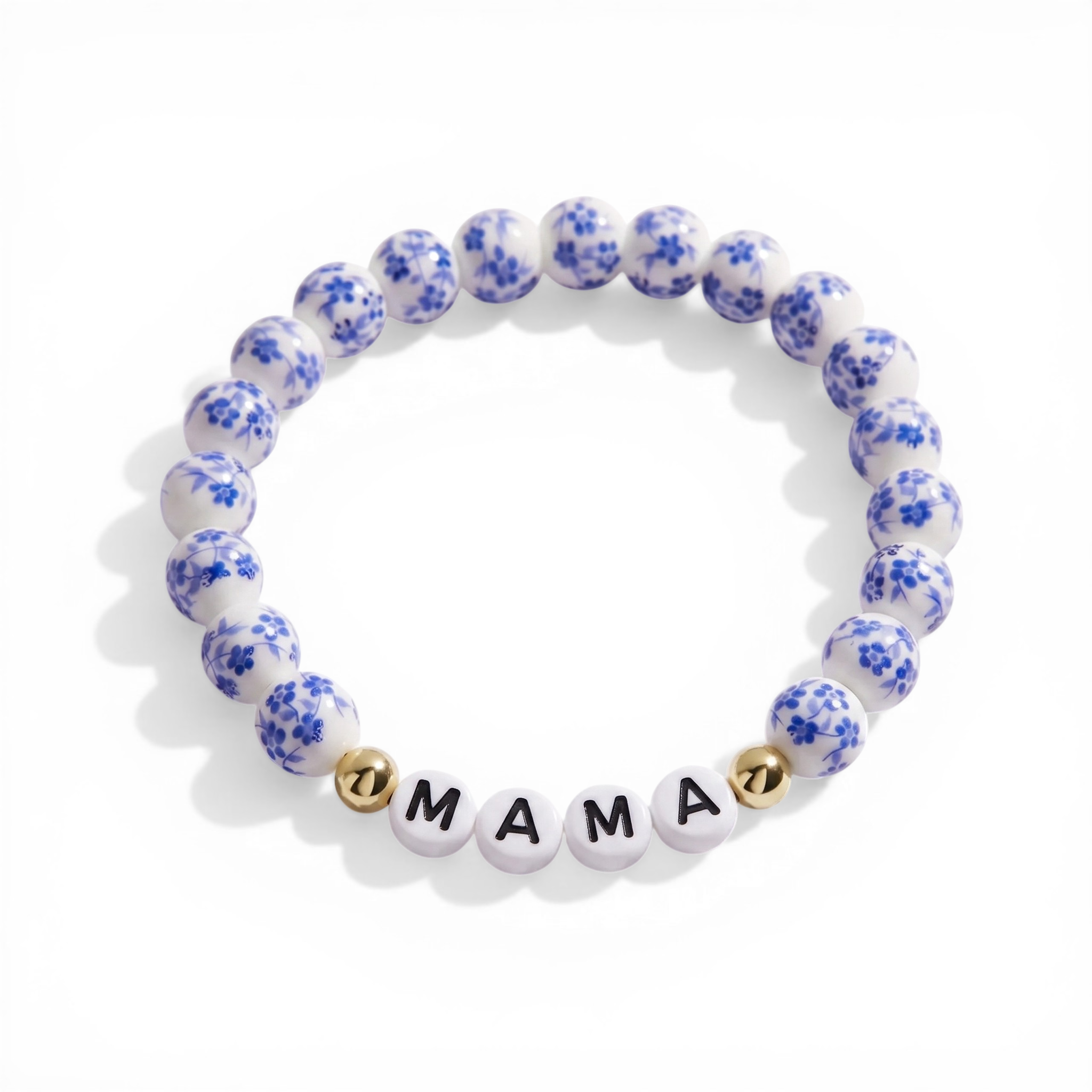 Bracelet with blue floral pattern and 'MAMA' beads on a white background