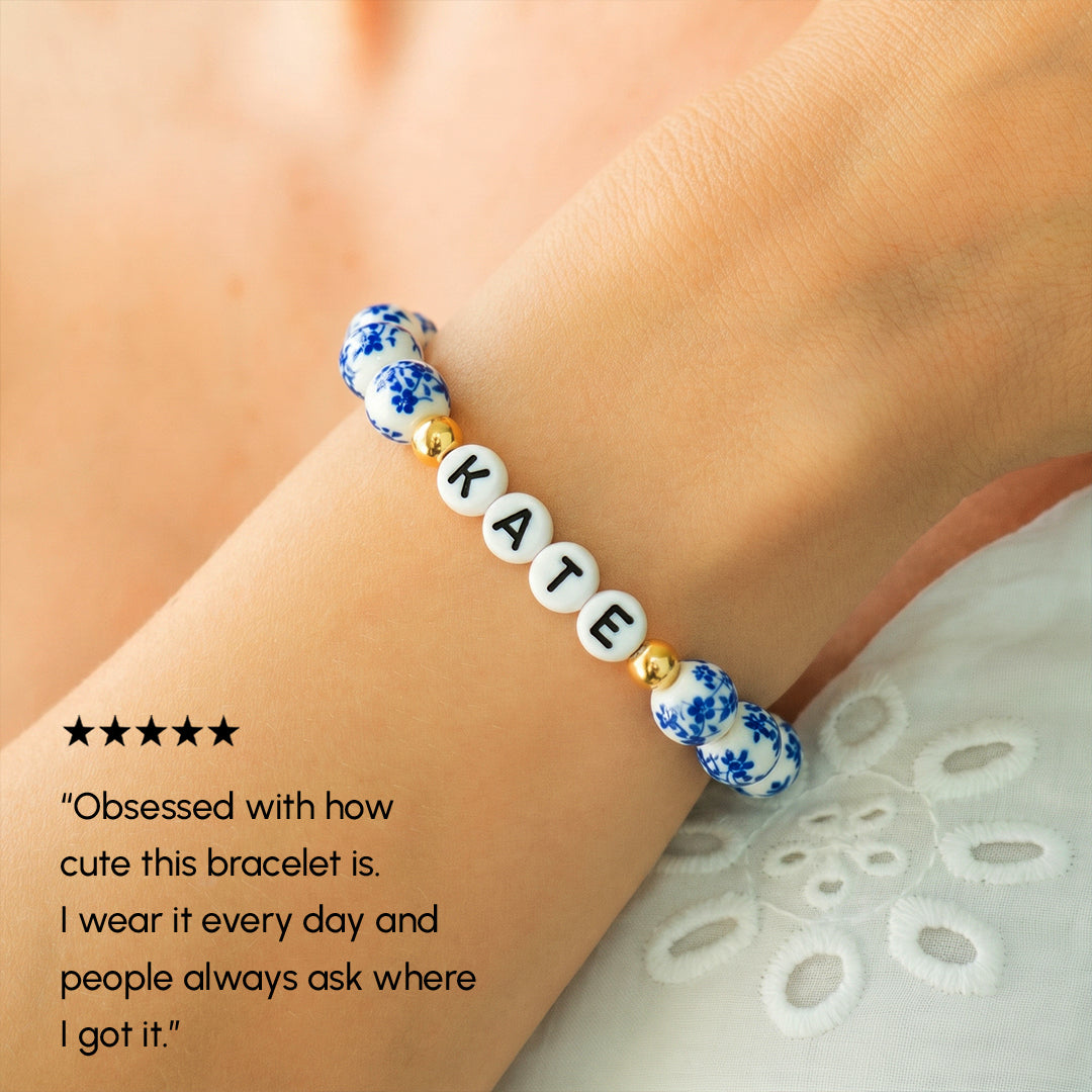 Bracelet with 'KATE' on a wrist, with a five-star rating and review text.