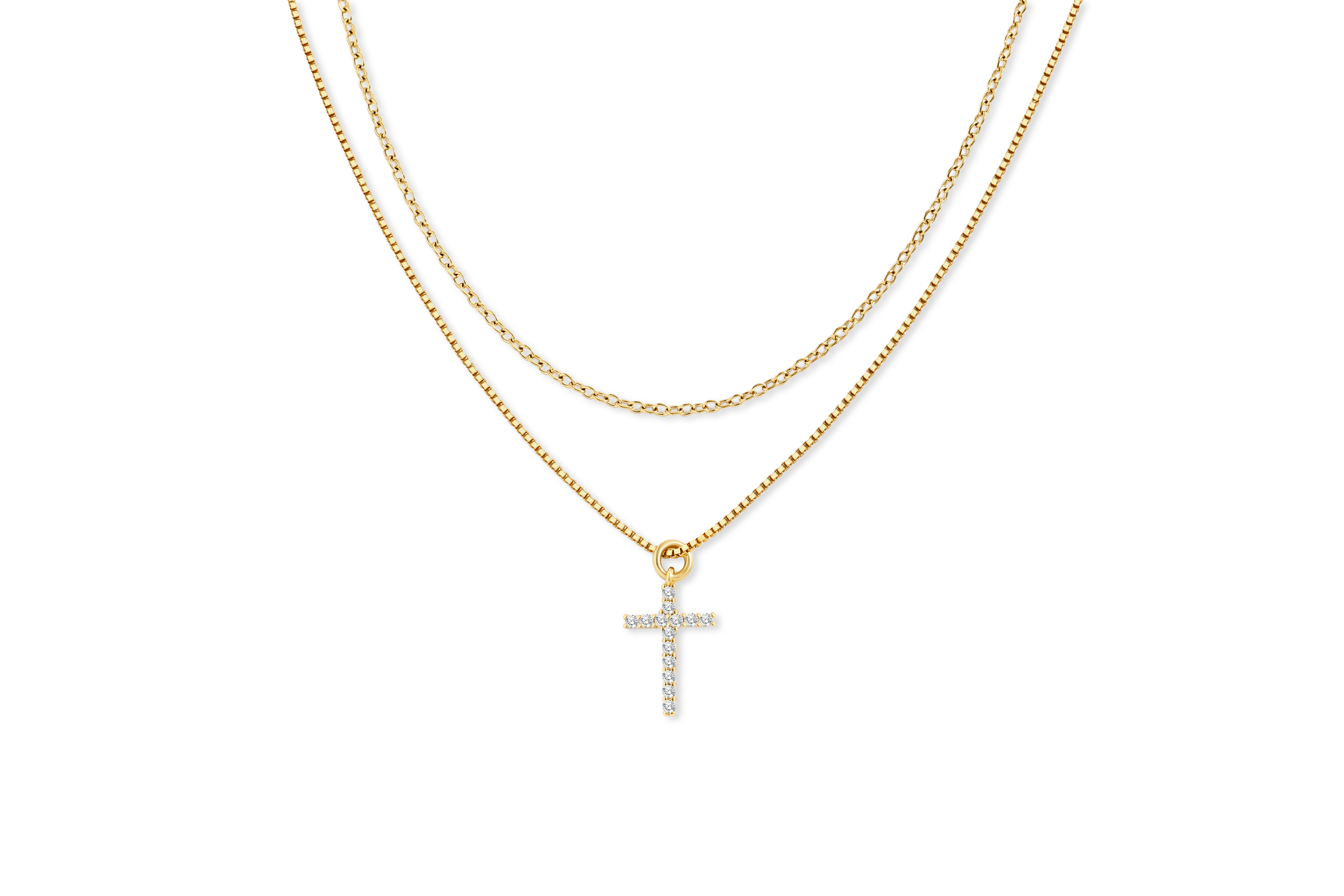 Gold cross necklace on a white background
