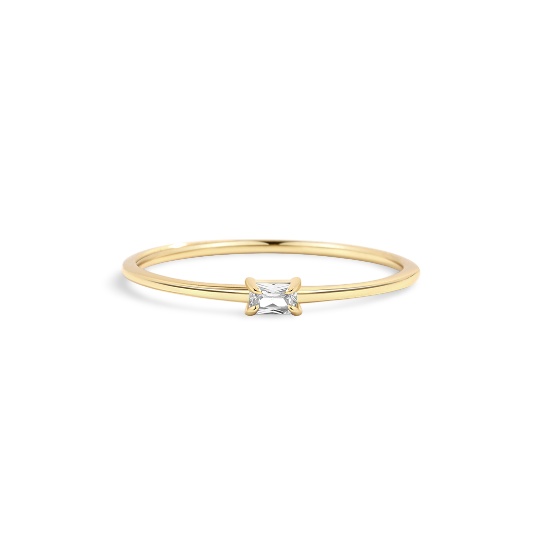 Gold ring with a diamond on a white background