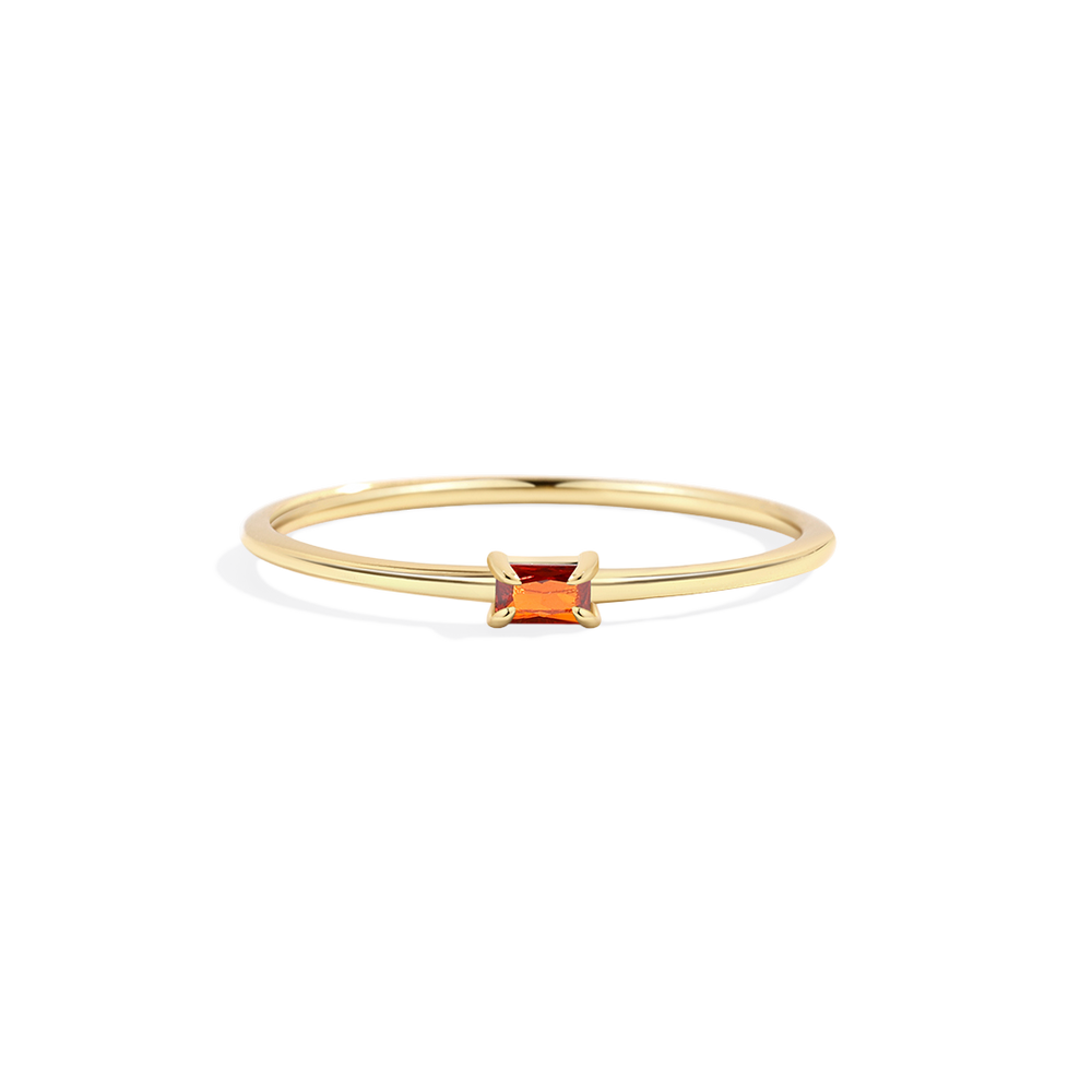 Gold ring with a square-cut orange gemstone on a white background