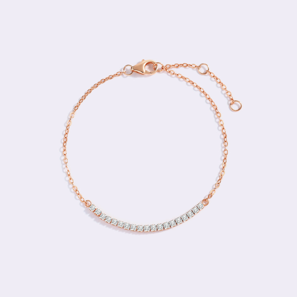 Rose gold bracelet with small diamonds on a light purple background