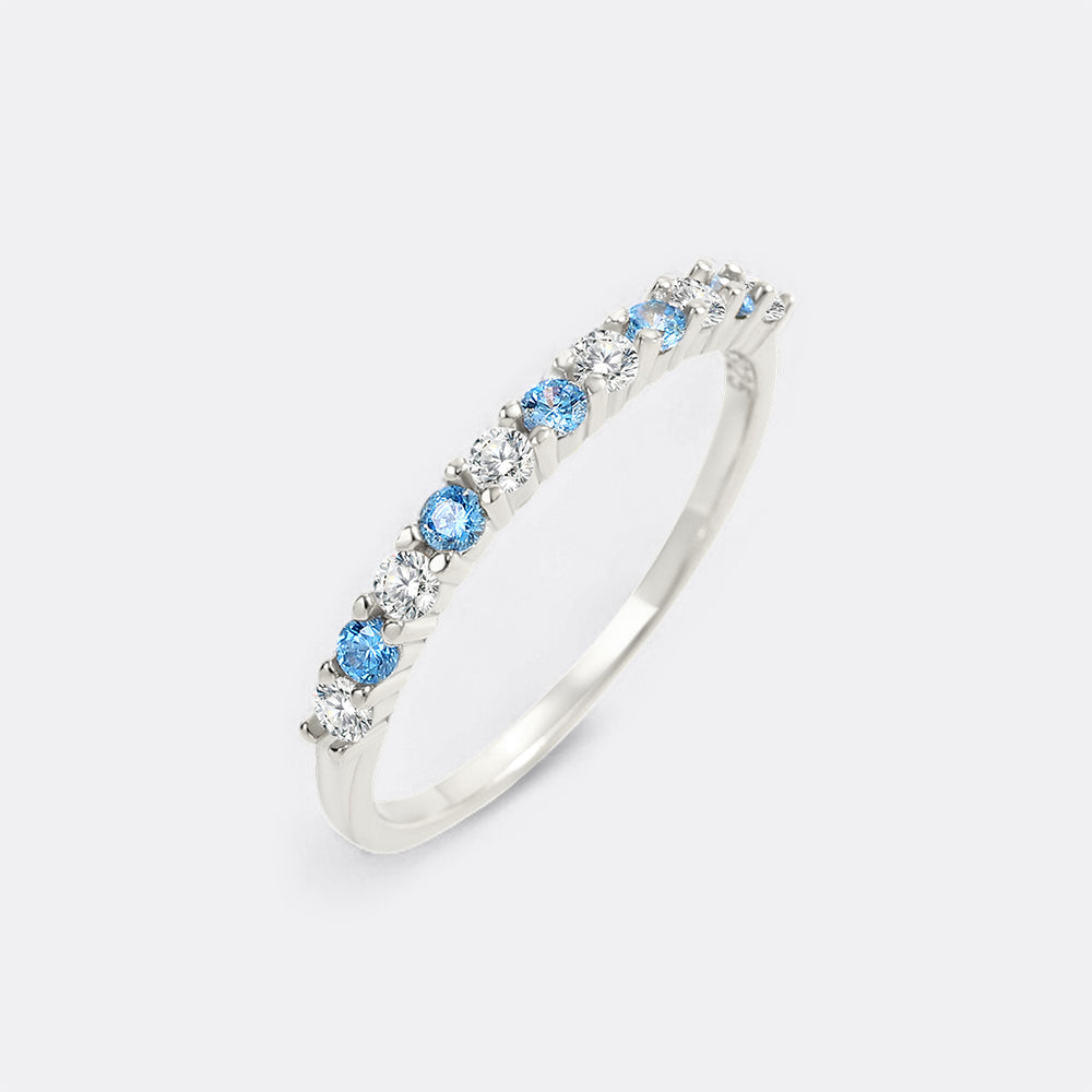 Silver ring with blue gemstones on a white background