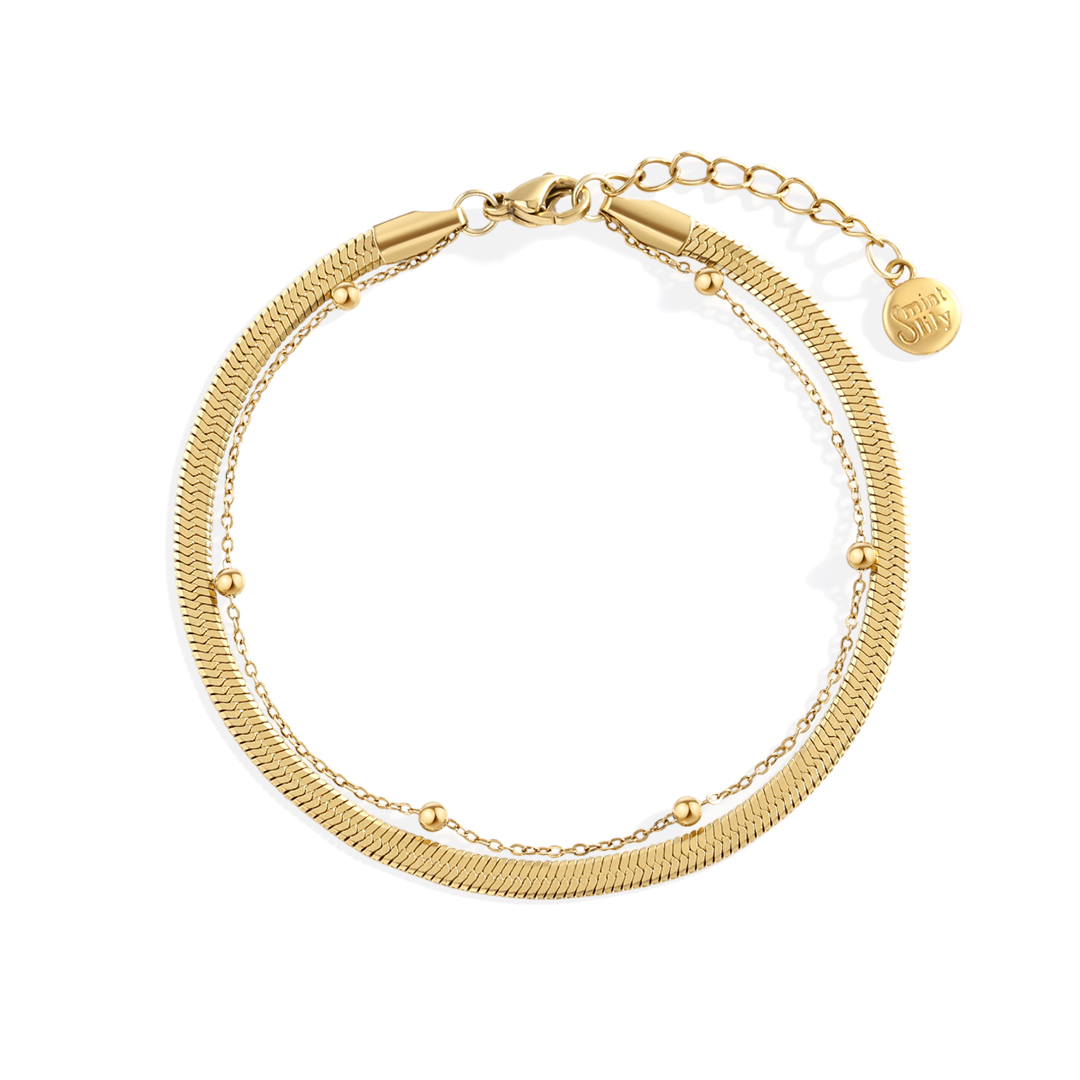 Gold bracelet on a white background