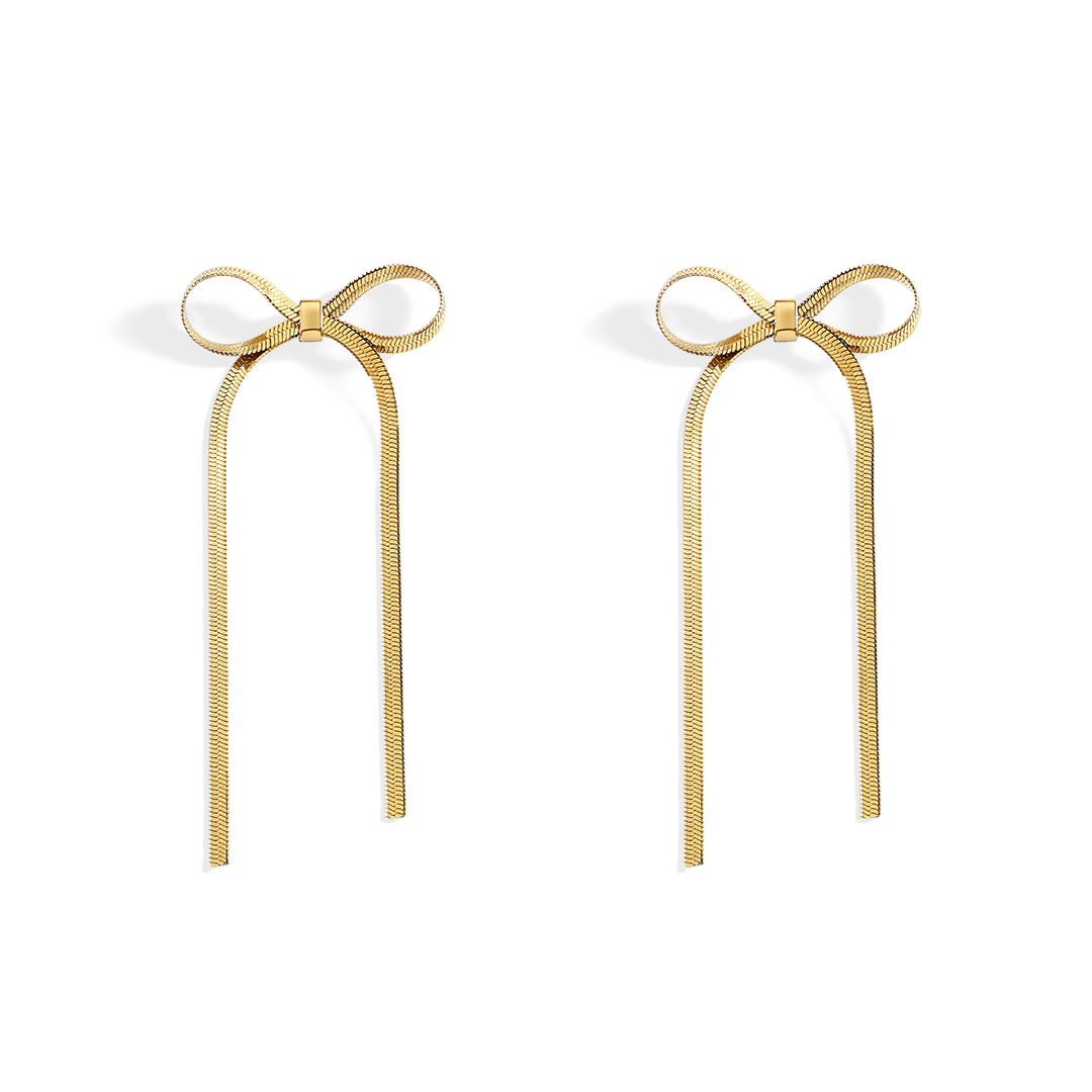 Gold bow-shaped earrings on a white background