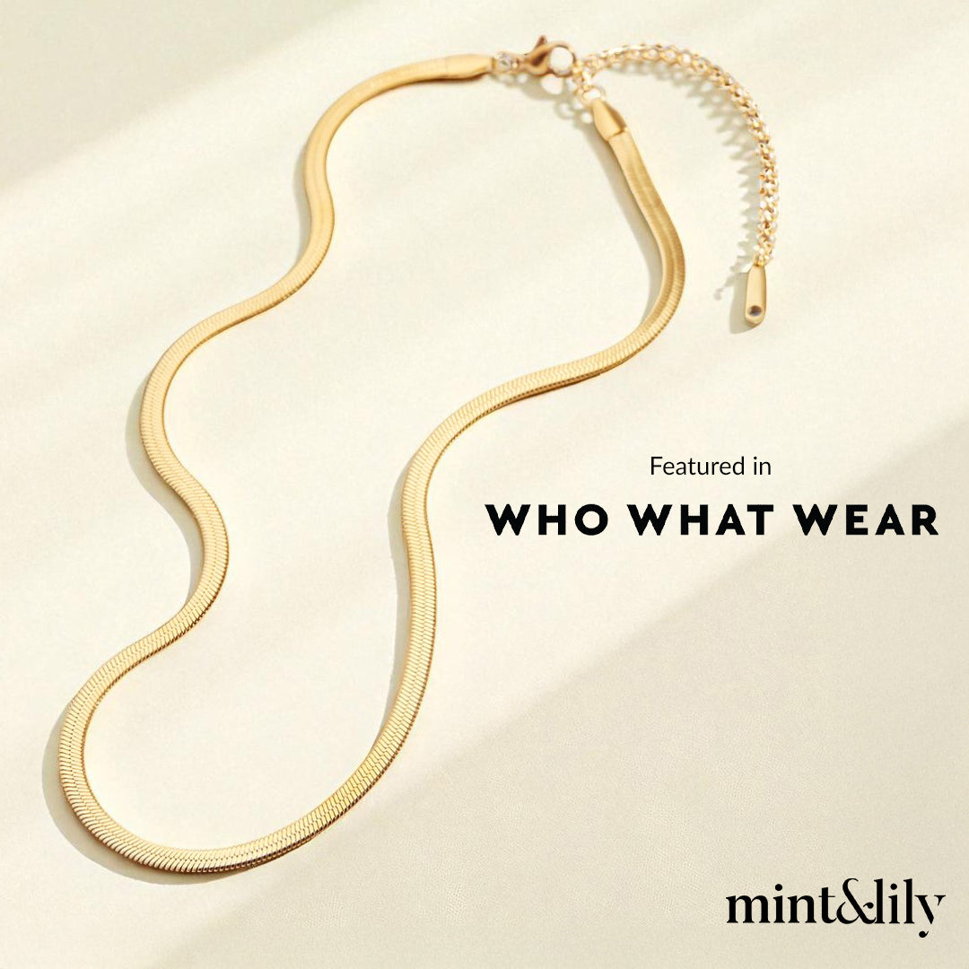 Gold necklace on a beige background with 'WHO WHAT WEAR' and 'mint&lily' text.