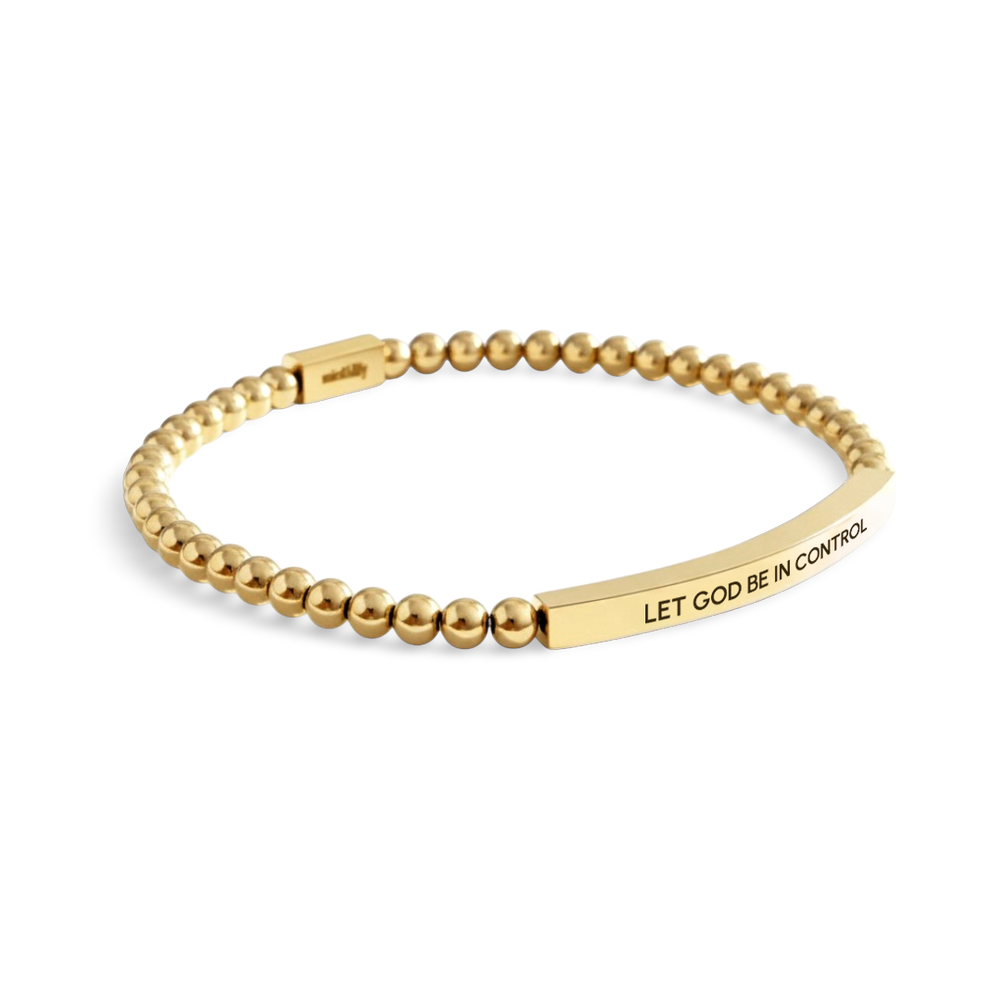 Gold beaded bracelet with a engraved message on a white background