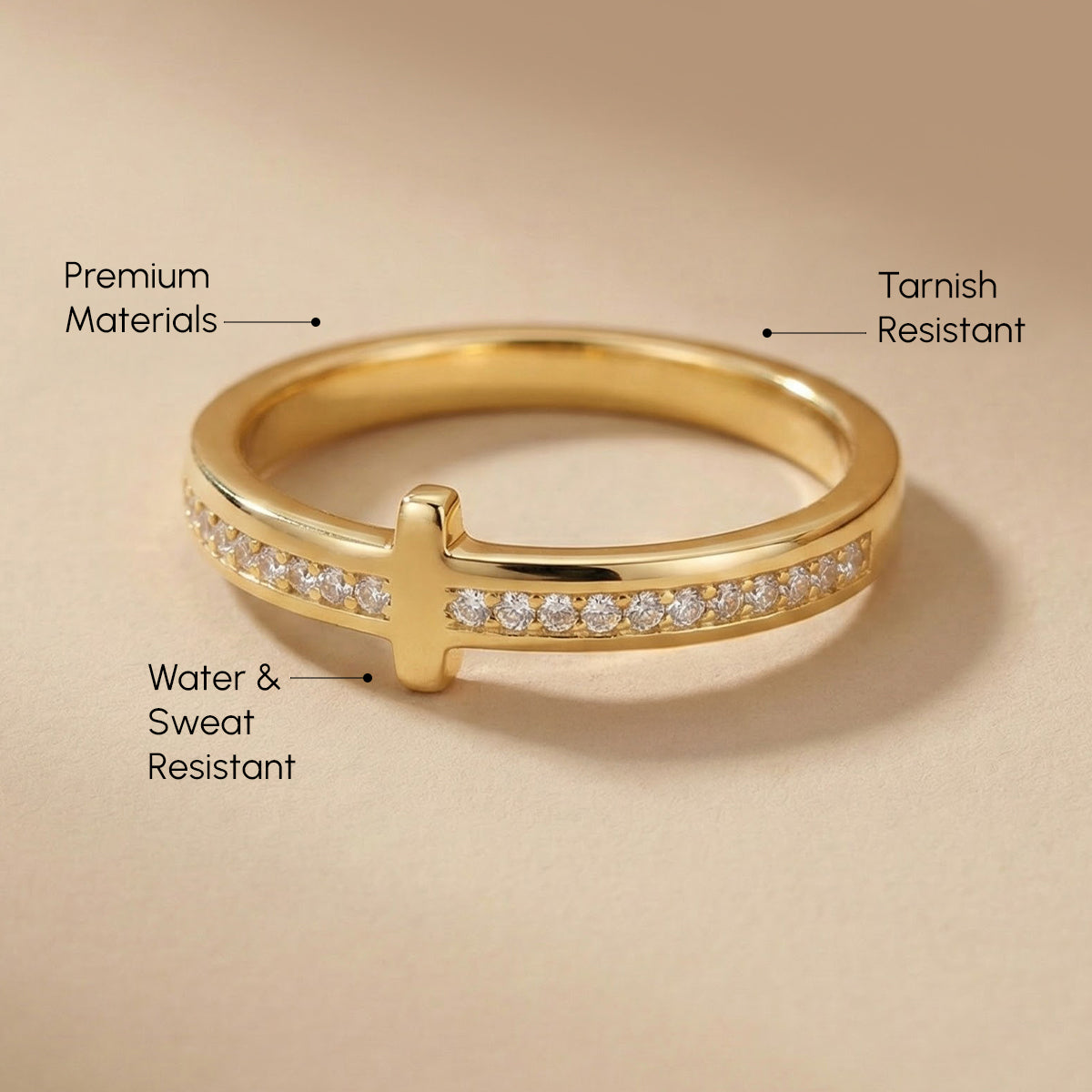Gold ring with diamond accents on a beige background