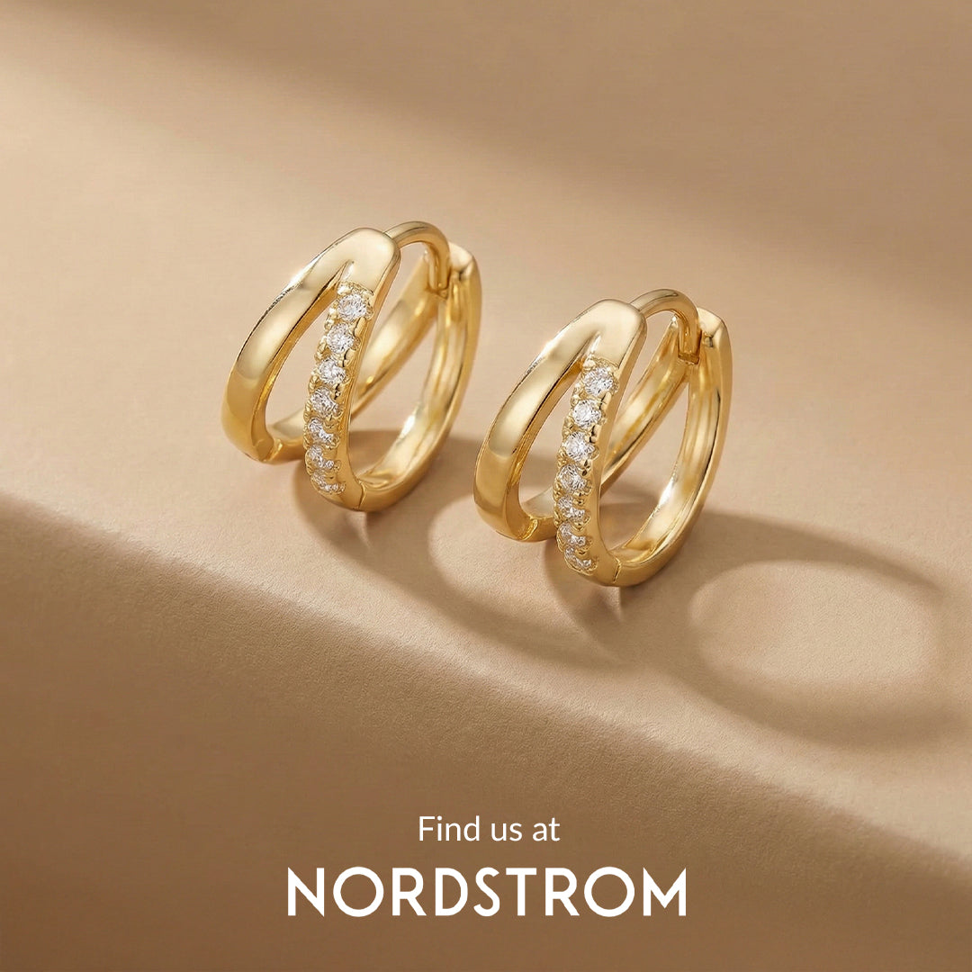 Gold hoop earrings with diamonds on a beige background, Nordstrom branding visible.