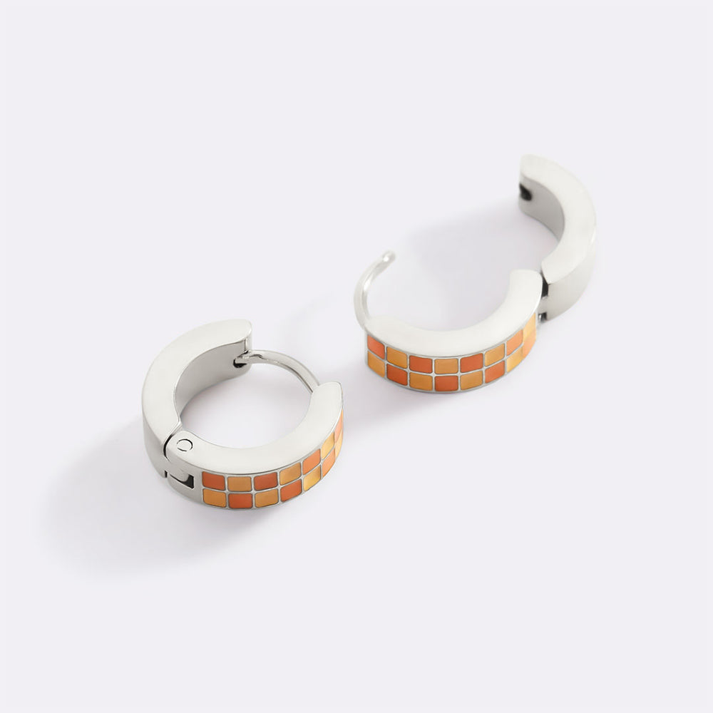 Pair of hoop earrings with mosaic design on a white background