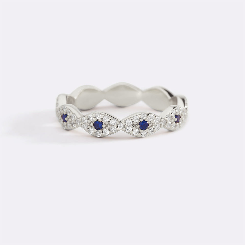 Silver ring with blue gemstones on a white background