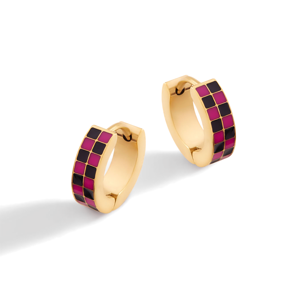 Gold hoop earrings with pink and black checkered pattern on a white background