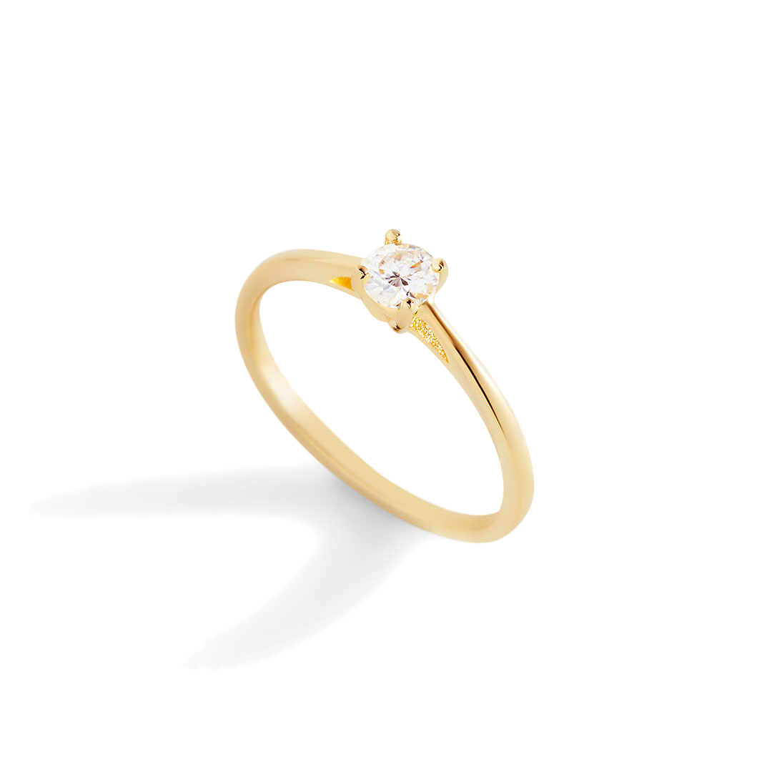 A gold solitaire ring with a single sparkling diamond set in a prong setting.