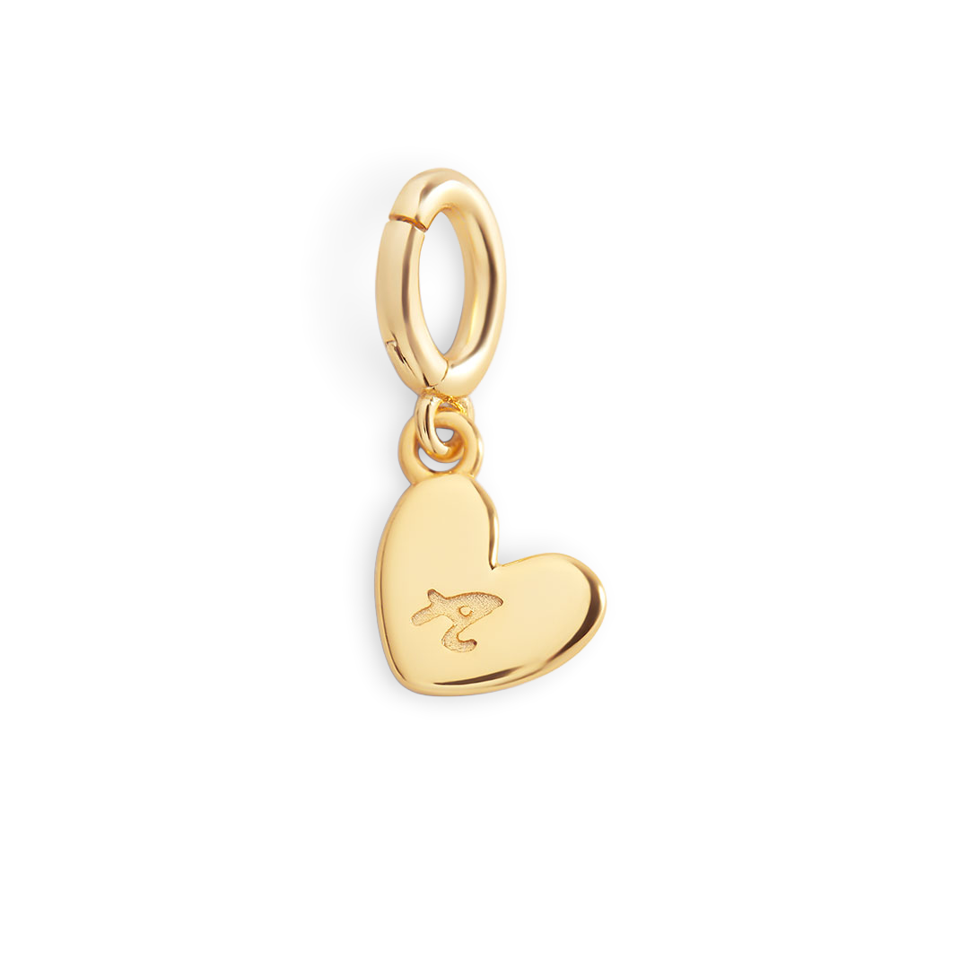 Gold heart-shaped pendant with a small design on a light gray background