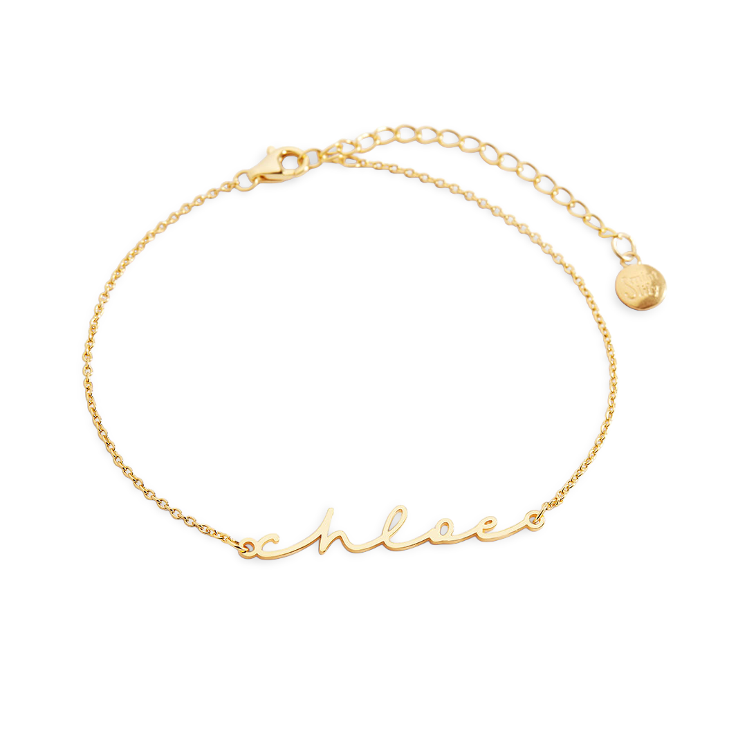 Gold bracelet with 'chloe' engraving on a white background