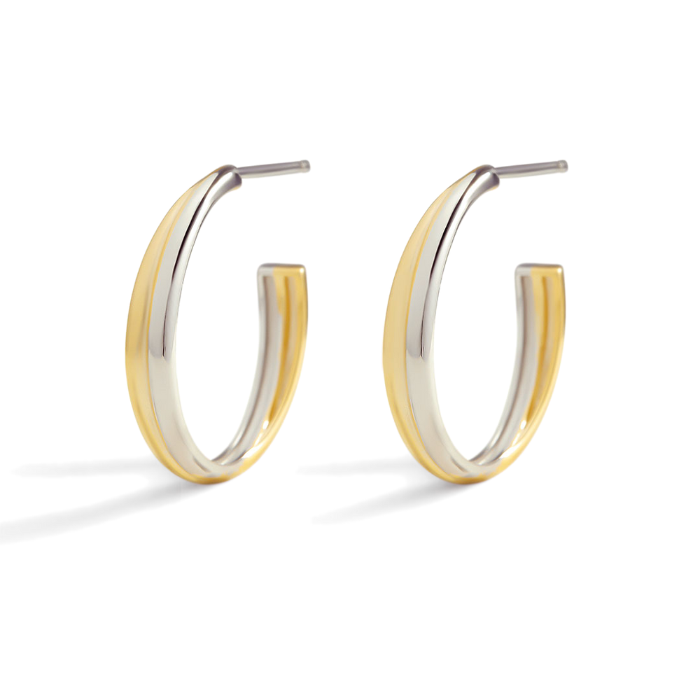 Two-tone gold and silver hoop earrings on a white background