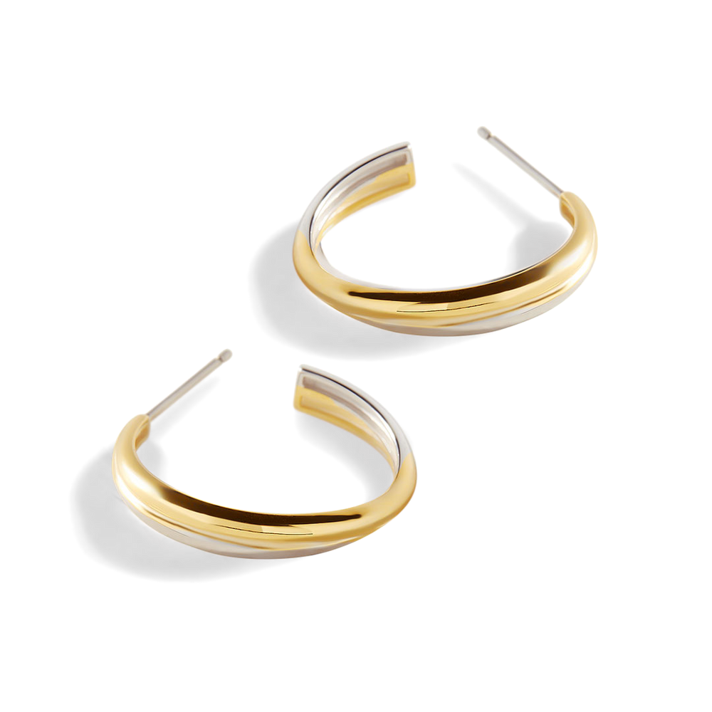 Gold hoop earrings on a white background