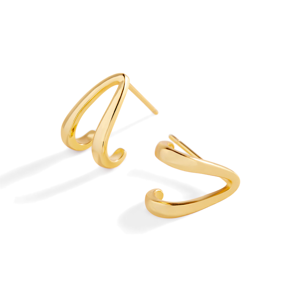 Gold open hoop earrings on a light gray background