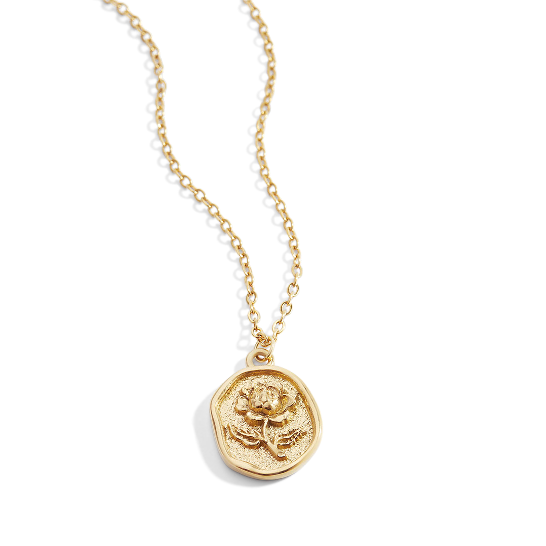 A gold-colored pendant necklace with a detailed rose stamp on the pendant, displayed against a white background.