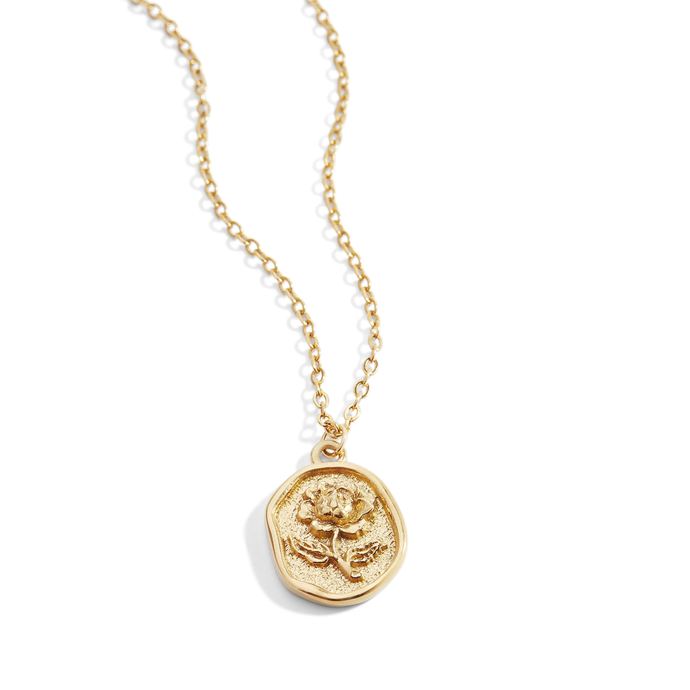 A gold-colored pendant necklace with a detailed rose stamp on the pendant, displayed against a white background.