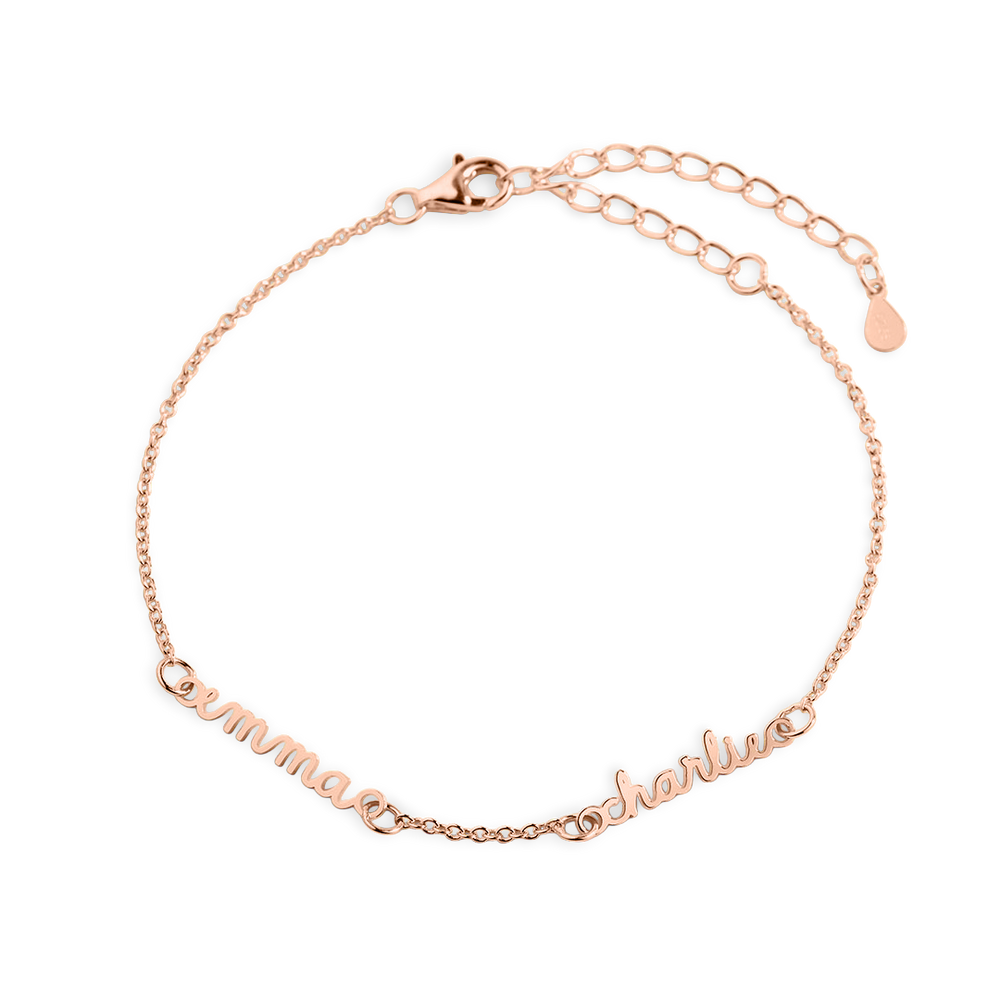 A gold-colored dainty cable chain bracelet with a lobster clasp, featuring multiple nameplates.