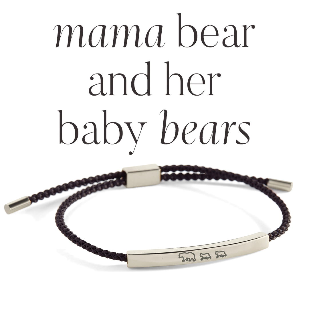 Bracelet with engraved design on a light background, featuring text 'mama bear and her baby bears'.