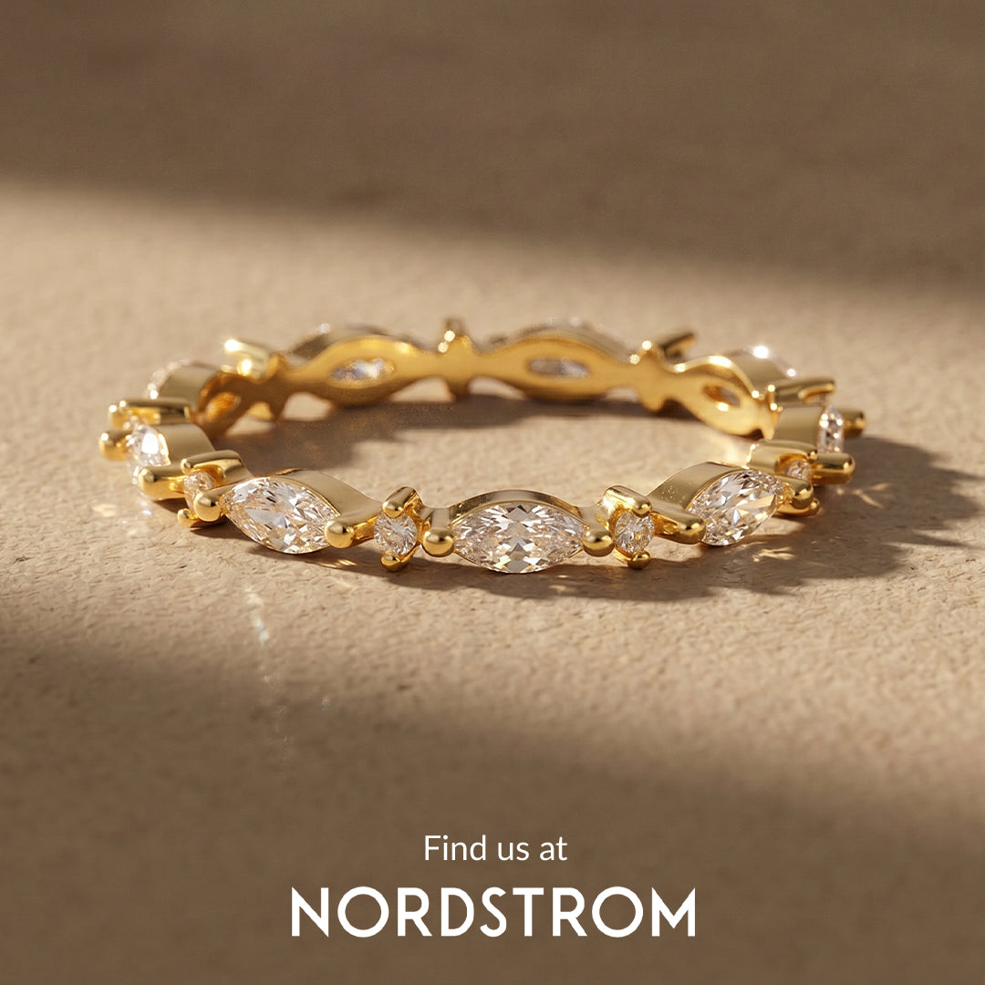 Gold ring with diamond accents on a beige background, Nordstrom branding visible.