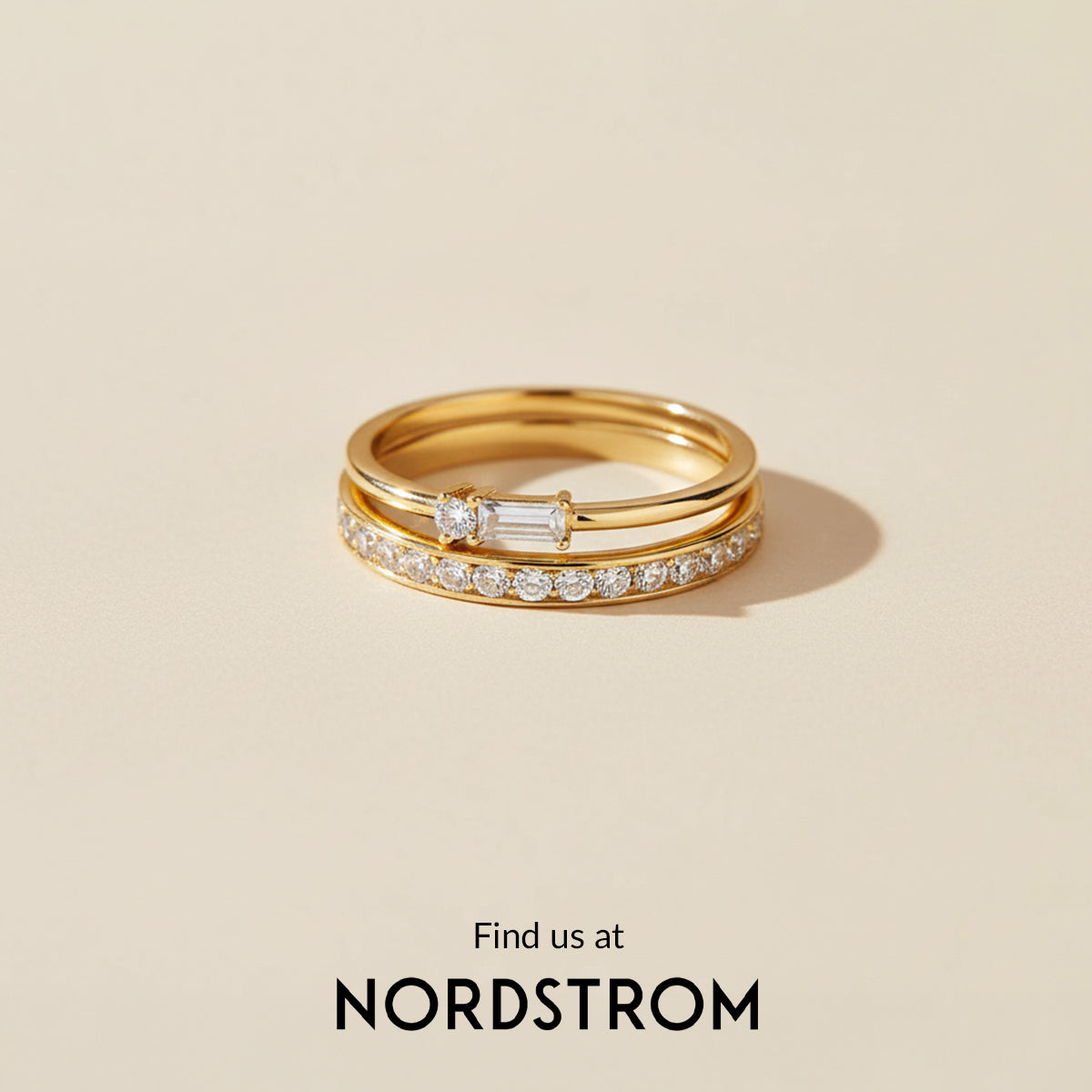 Gold ring with diamonds on a beige background, Nordstrom branding visible.