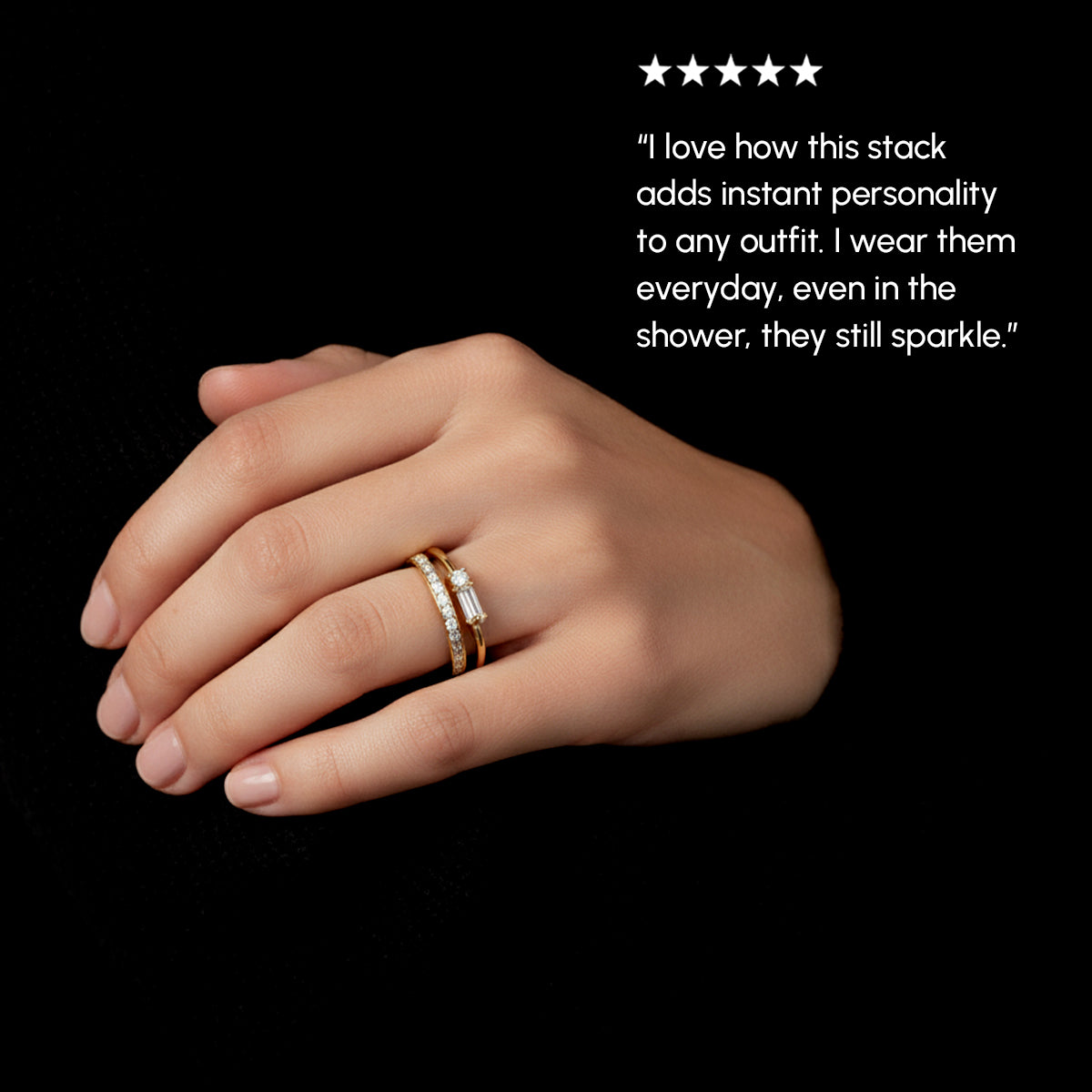Hand wearing two gold rings with a five-star rating and customer review on a black background