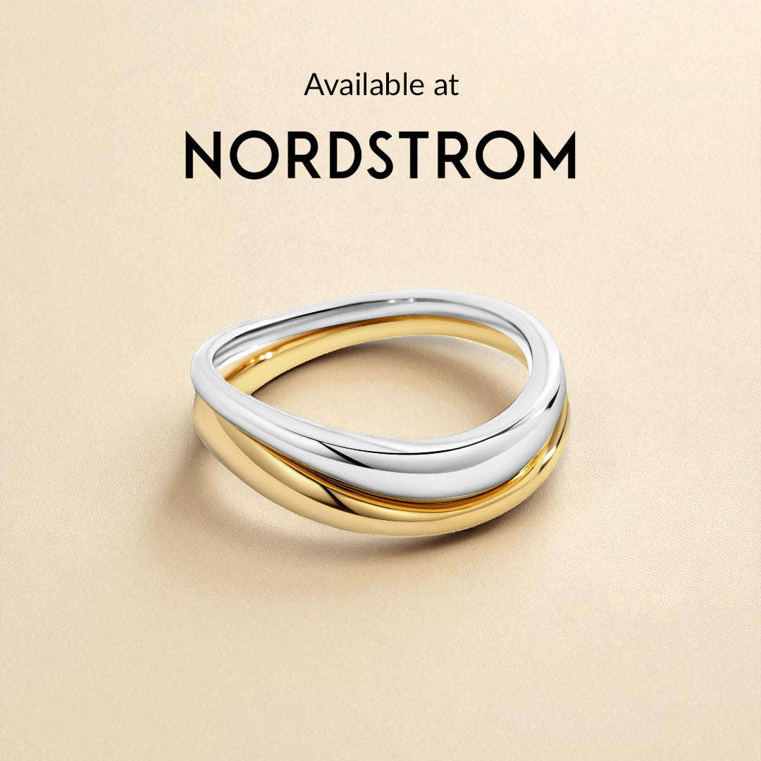 Gold and silver ring on a beige background with 'Nordstrom' branding.