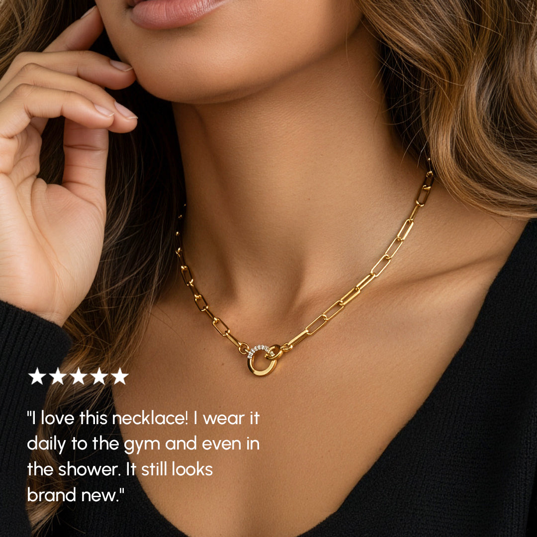 Gold chain necklace worn by a person with a five-star rating text overlay.