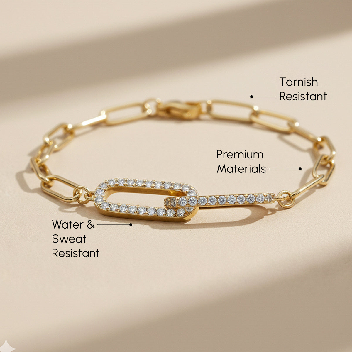 Gold bracelet with diamond accents on a beige background