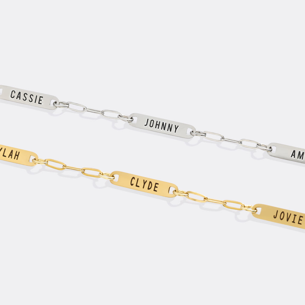 Two bracelets with engraved names on a white background