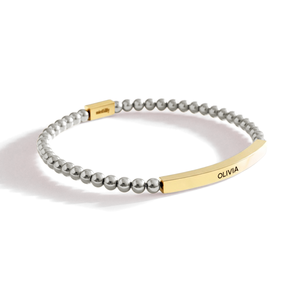 Bracelet with gold and silver elements on a white background